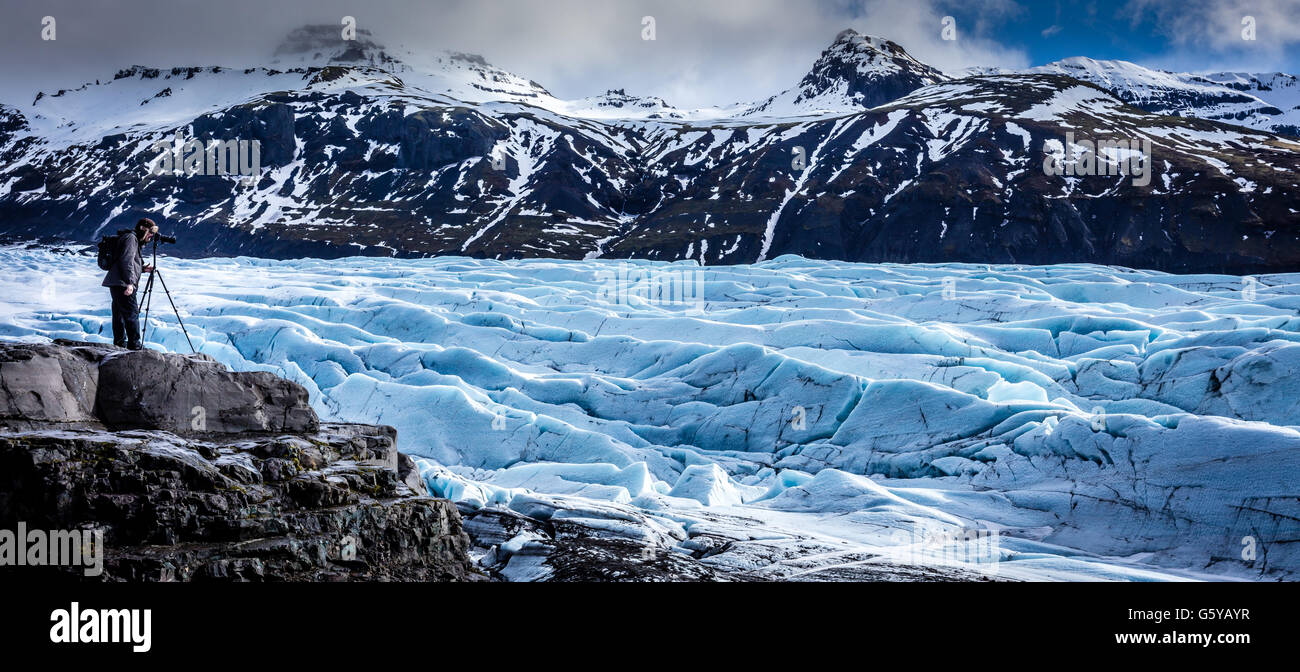 Photographer capturing a landscape in Iceland Stock Photo