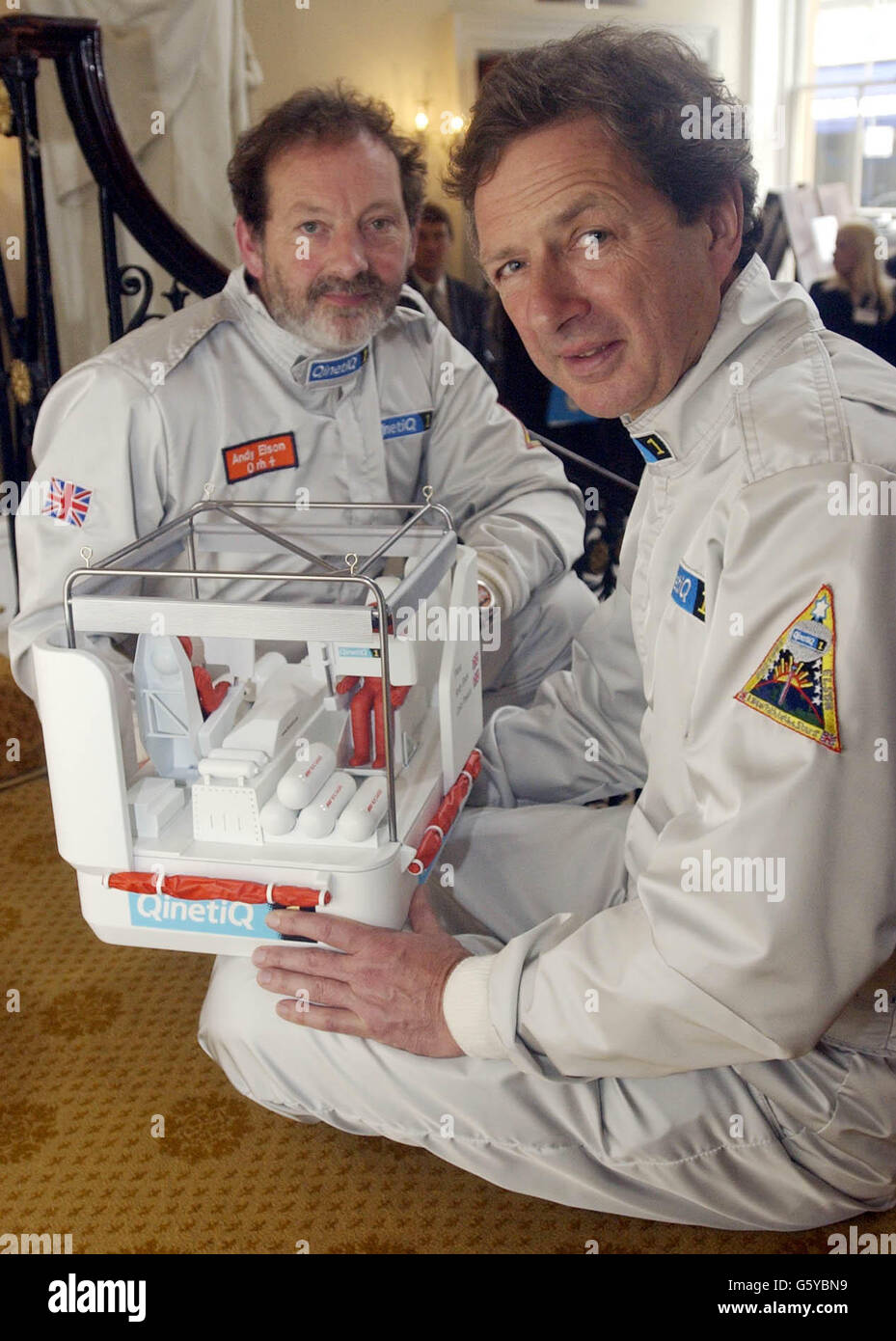 Ballonists Andy Elson (left) and Colin Prescot pose with a model of the cockpit from their balloon at the Royal Institute in London. * The two British pilots who plan to break the world altitude record for a manned balloon flight today began examining weather data for a 72-hour window to enable them to launch their balloon QinetiQ1 before hopefully soaring 25 miles (132,000ft) high. See PA story ADVENTURE Balloon. PA Photo: Chris Young Stock Photo