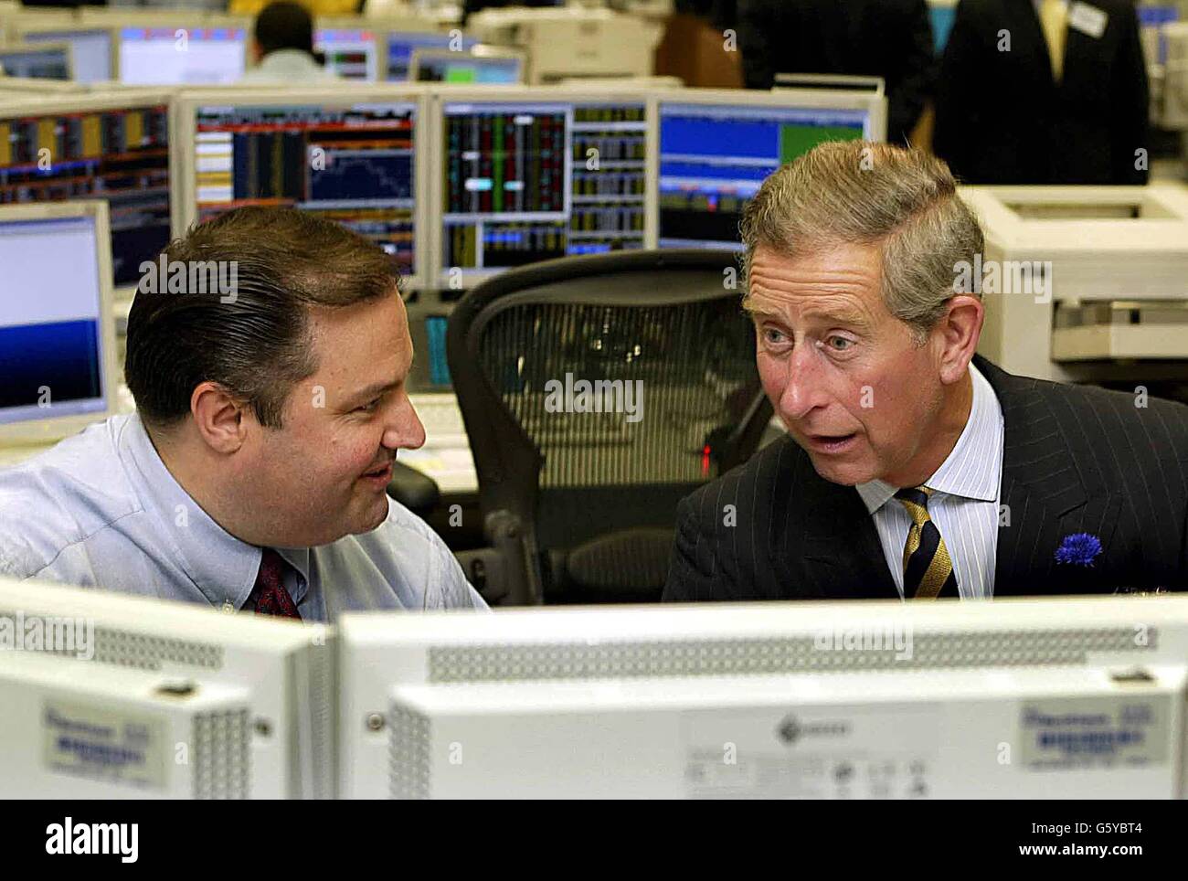 The Prince of Wales talks with equities trader Grant Turner during a visit to the trading floors of the Merrill Lynch Financial Centre, in the City. Stock Photo