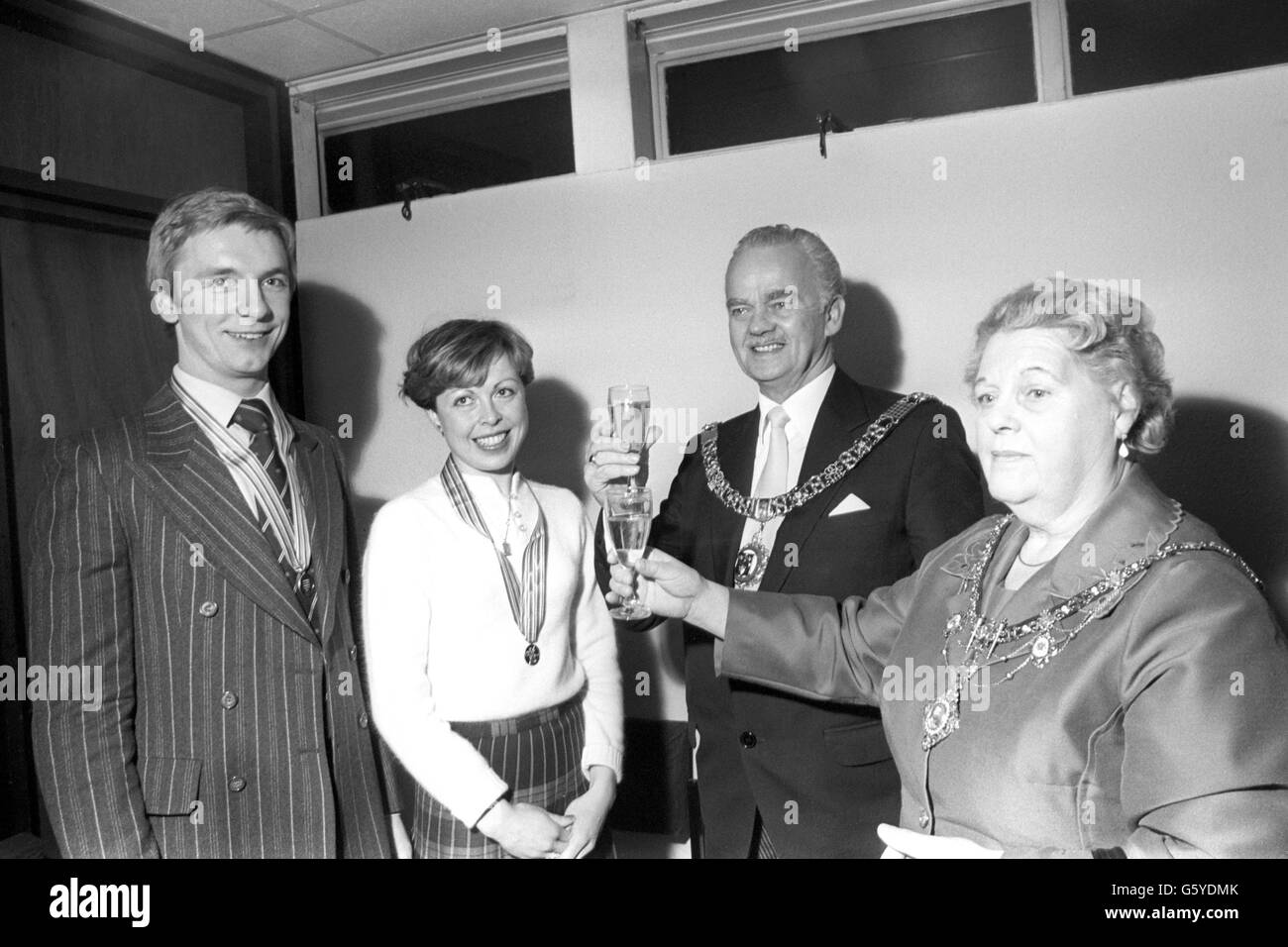 The Lord and Lady Mayoress of Nottingham, Councillor Tom and Mrs Nancy Wilkins giving a champagne welcome to Christopher Dean and Jayne Torvill at the East Midlands airport at Castle Donnington after they returned home from their gold medal success in the European Ice Dancing championships at Innsbruck. Stock Photo