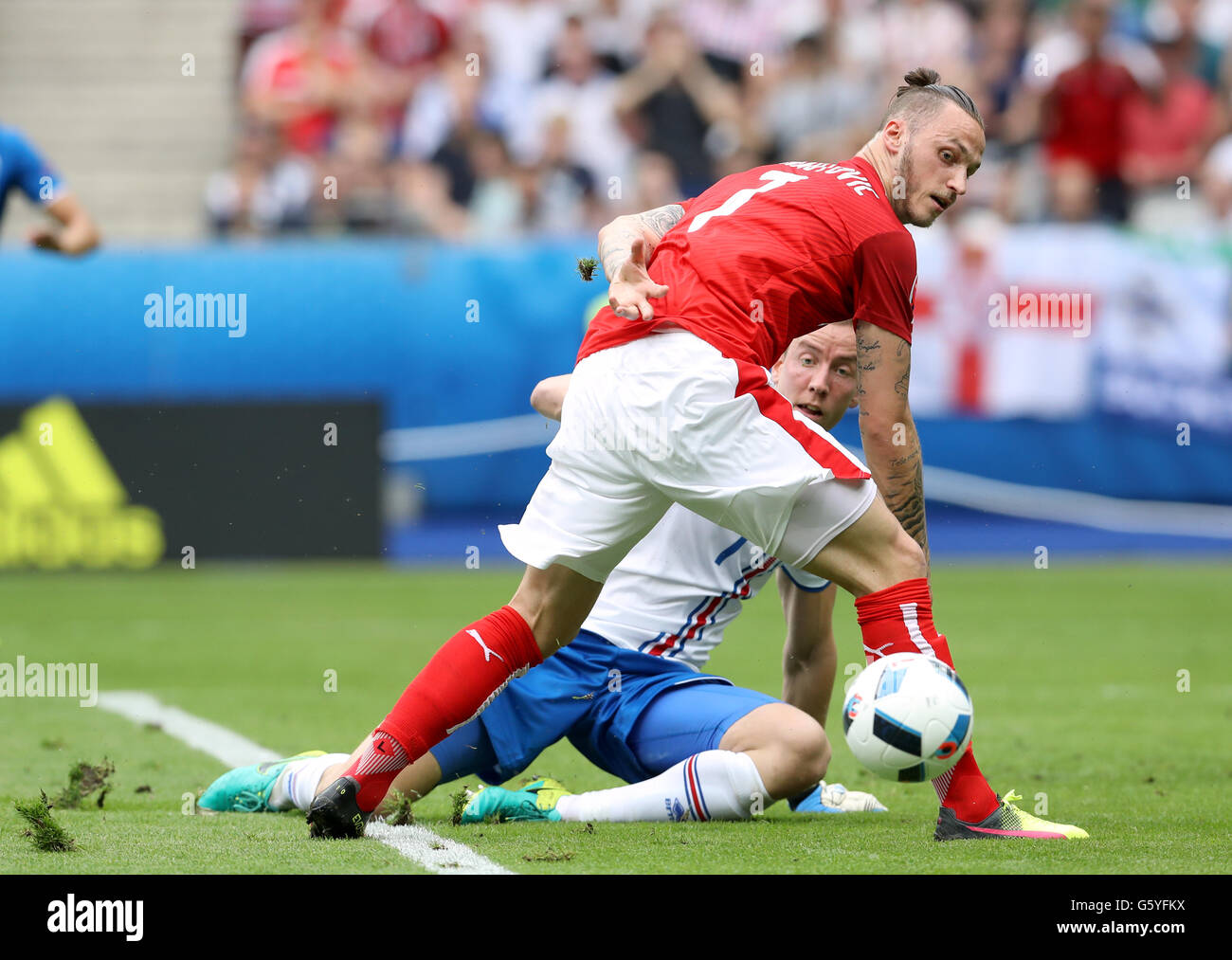 Iceland goalkeeper Hannes Thor Halldorsson manages to clear after a mistake nearly allows Austria's Marko Arnautovic (7) to score during the Euro 2016, Group F match at the Stade de France, Paris. Stock Photo