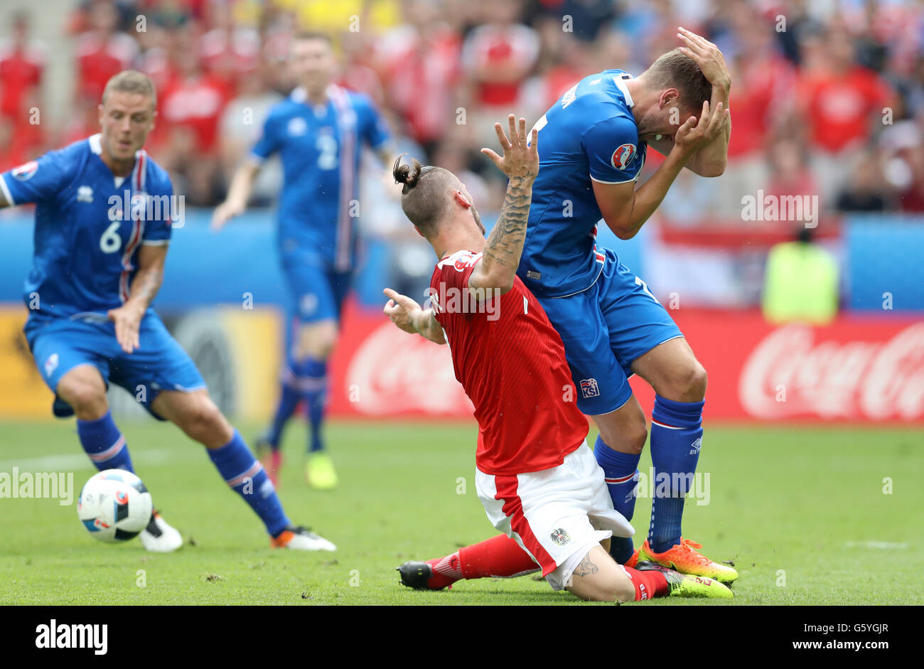 Austria's Marko Arnautovic (left) and Iceland's Kari Arnason battle for the ball during the Euro 2016, Group F match at the Stade de France, Paris. Stock Photo