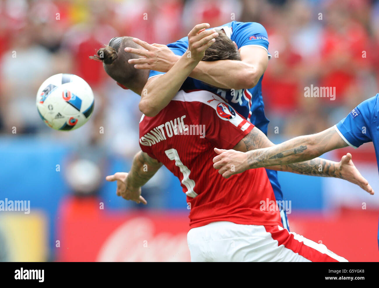 Austria's Marko Arnautovic (left) and Iceland's Kari Arnason battle for the ball during the Euro 2016, Group F match at the Stade de France, Paris. Stock Photo