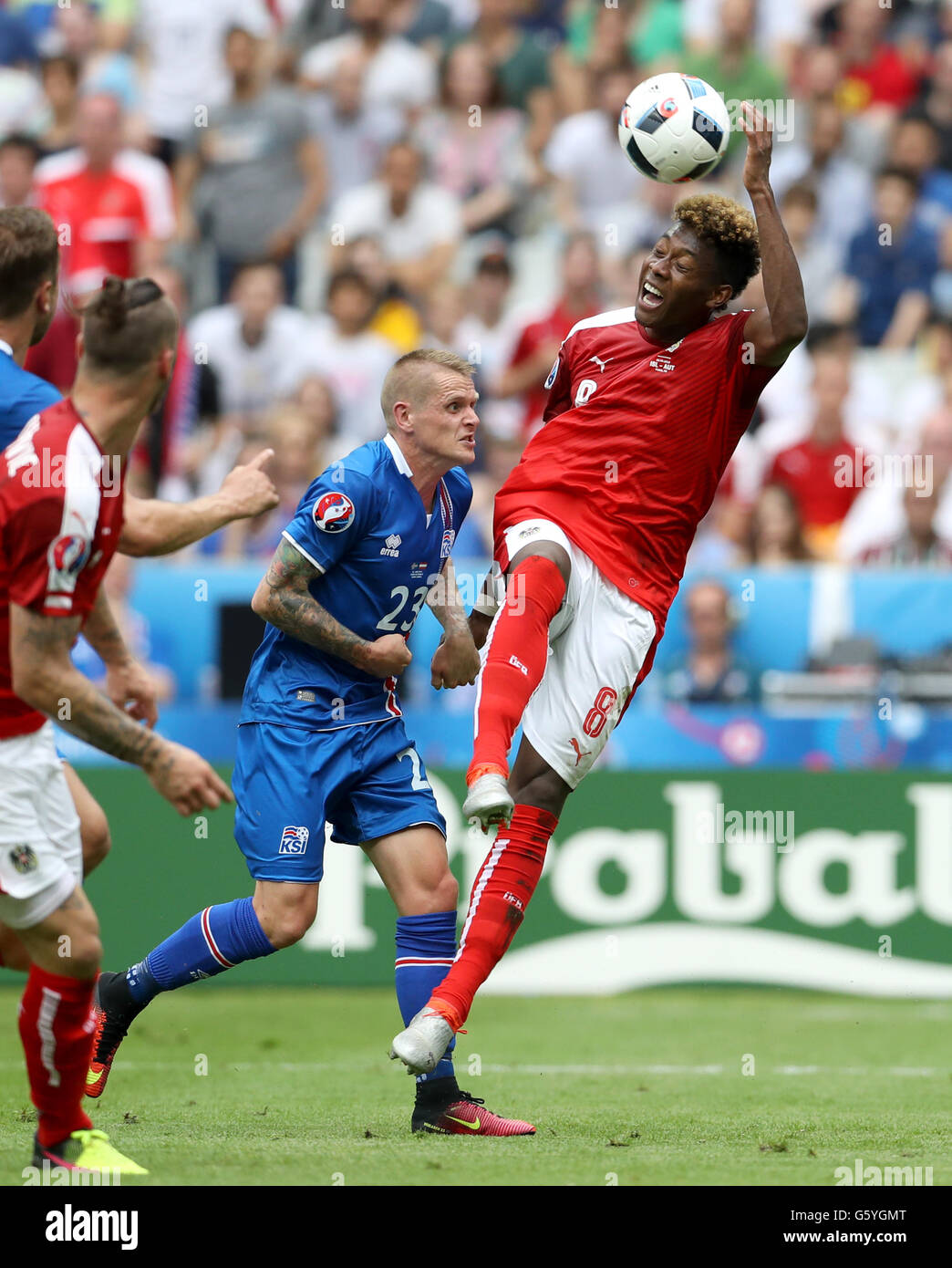 Iceland's Ari Freyr Skulason (left) fouls Austria's David Alaba to give away a penalty during the Euro 2016, Group F match at the Stade de France, Paris. Stock Photo