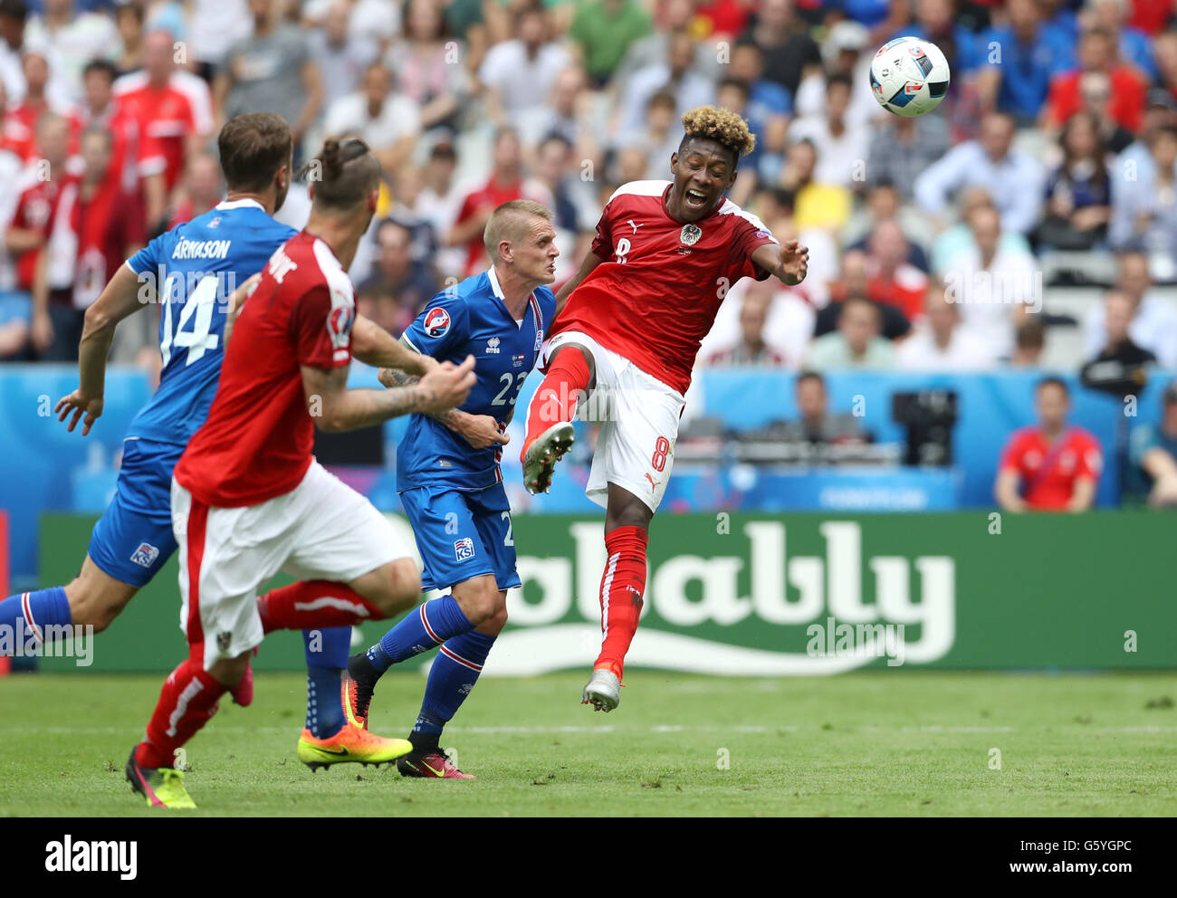 Iceland's Ari Freyr Skulason (left) fouls Austria's David Alaba to give away a penalty during the Euro 2016, Group F match at the Stade de France, Paris. Stock Photo