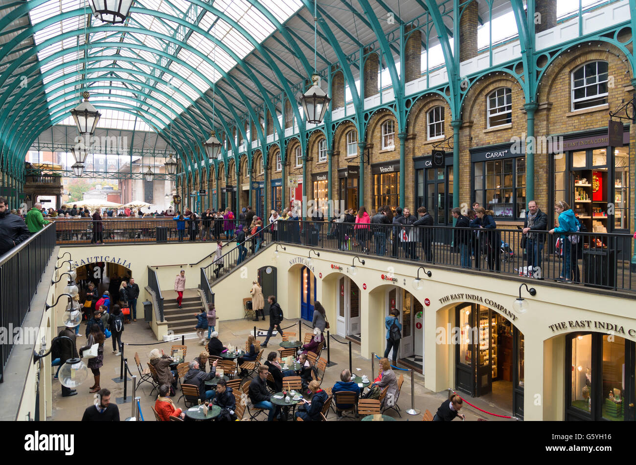 LONDON, ENGLAND - OCTOBER 21, 2015: Unknown tourists in Apple Market in Covent garden, a former vegetable market Stock Photo