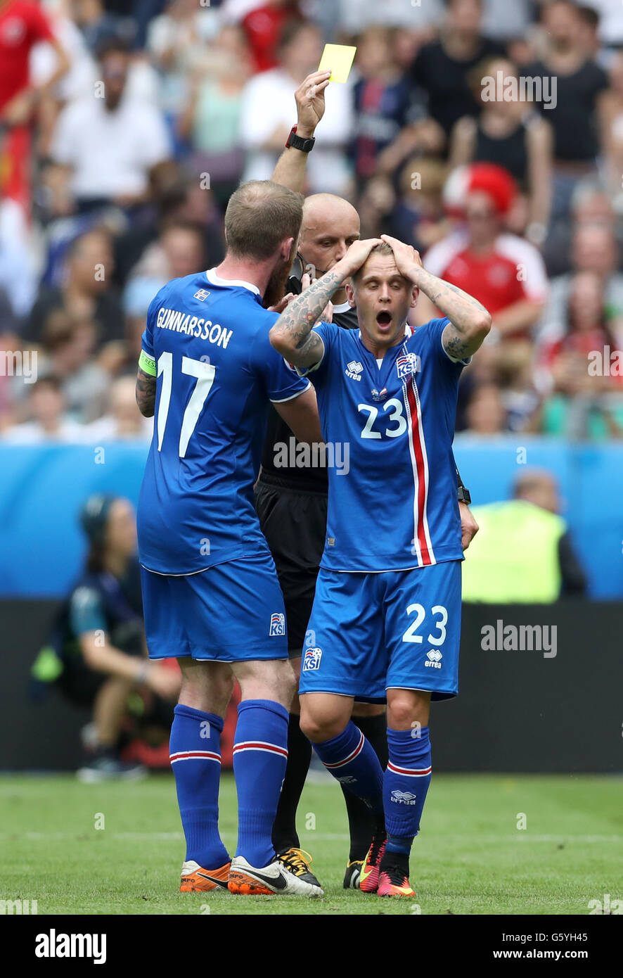 Iceland's Ari Freyr Skulason is shown the yellow card after giving away a penalty during the Euro 2016, Group F match at the Stade de France, Paris. Stock Photo