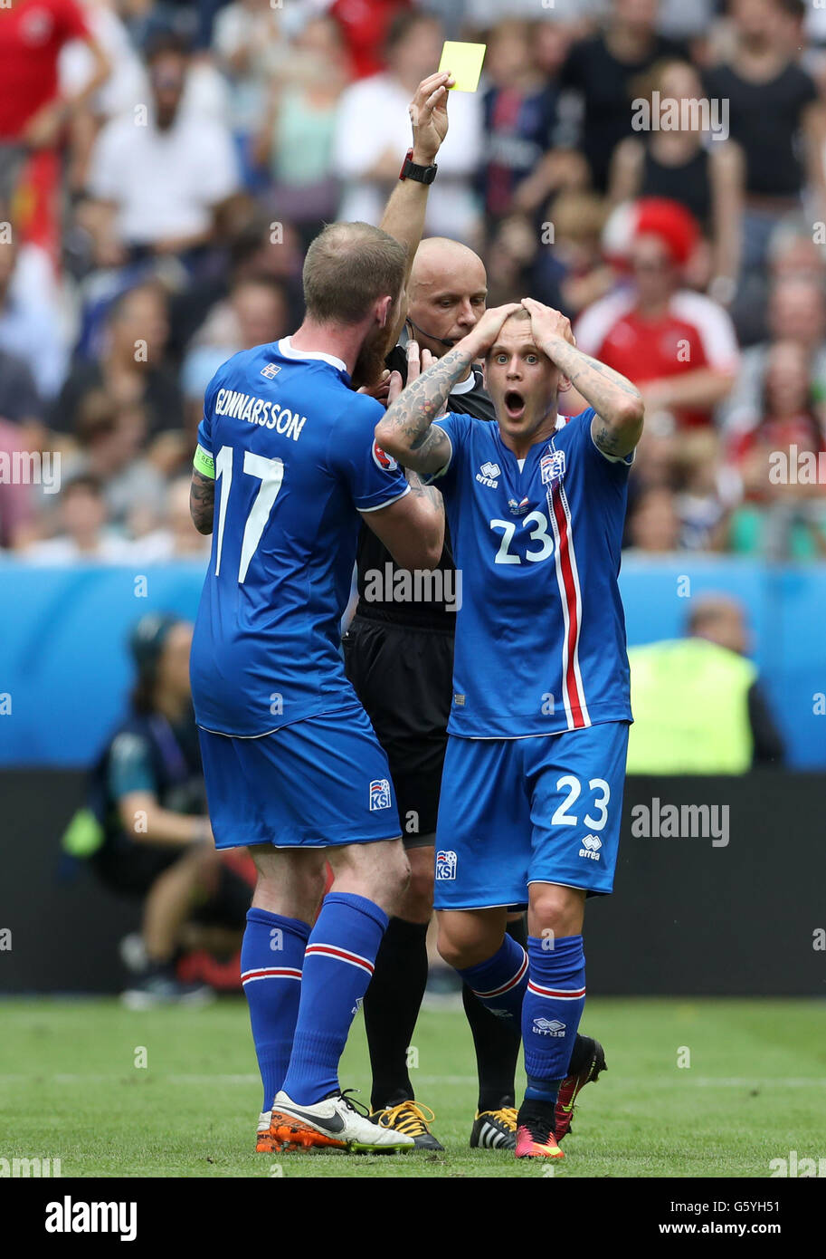 Iceland's Ari Freyr Skulason is shown the yellow card after giving away a penalty during the Euro 2016, Group F match at the Stade de France, Paris. Stock Photo