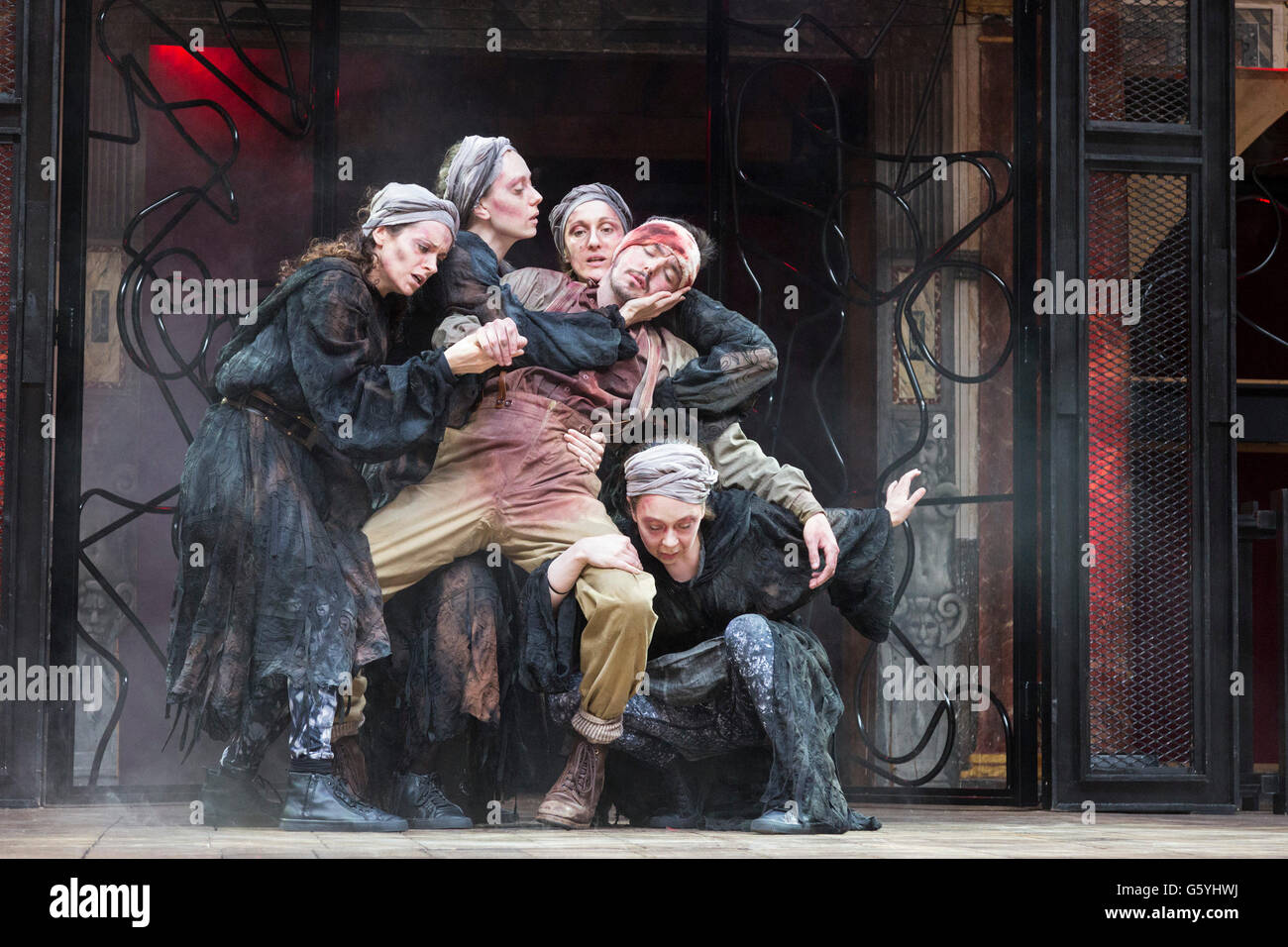 London, UK. 22 June 2016. Pictured: Terence Keeley as Bloody Captain and Nadia Albina, Danielle Bird, Scarlett Brookes and Kerry Gooderson as Wyrd Sisters. The Globe Theatre presents Macbeth directed by Iqbal Khan. Shows run from 18 June to 1 October 2016. With Ray Fearon as Macbeth and Tara Fitzgerald as Lady Macbeth. Stock Photo