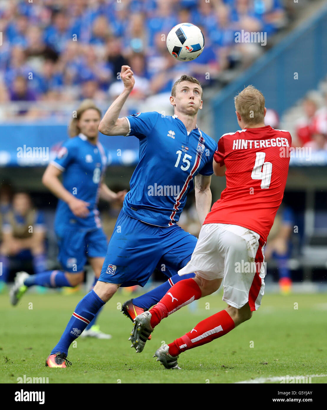 Iceland's Jon Dadi Bodvarsson (left) and Austria's Martin Hinteregger battle for the ball during the Euro 2016, Group F match at the Stade de France, Paris. Stock Photo