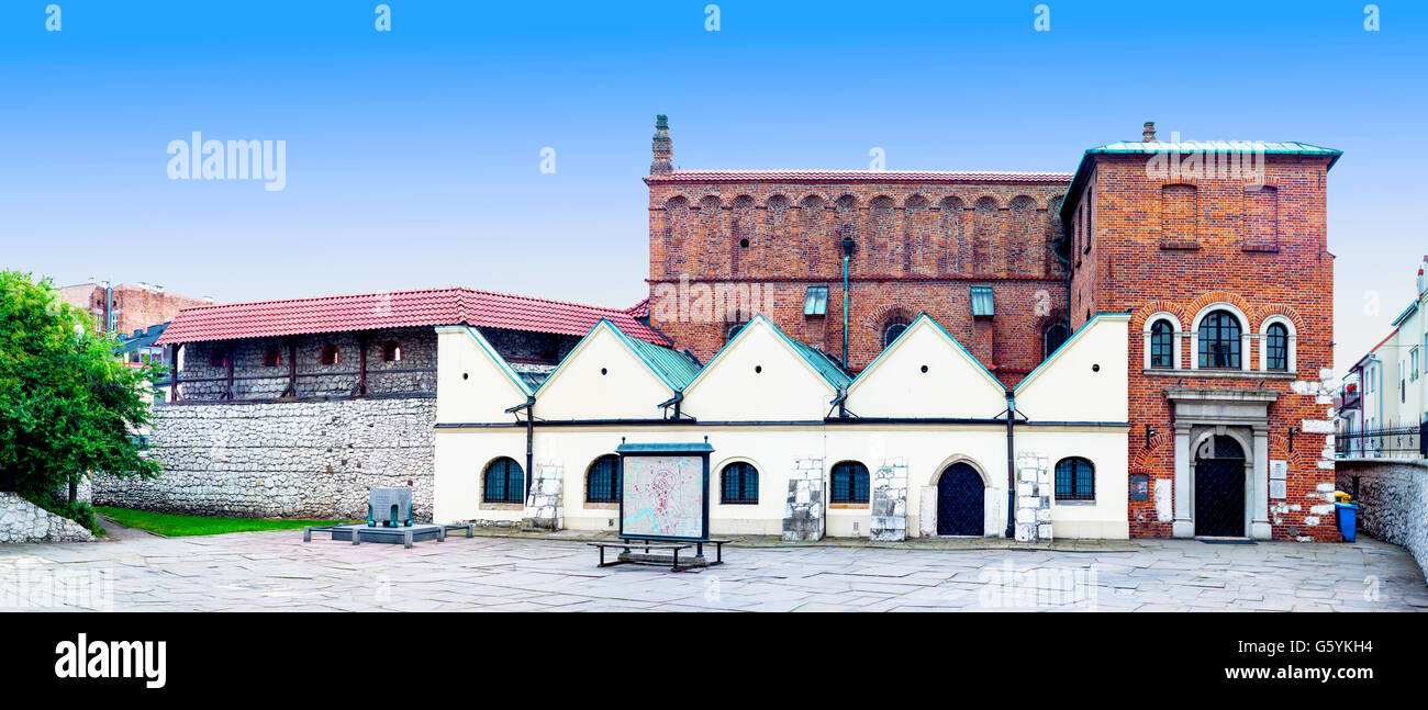 Old Synagogue in historic Jewish Kazimierz district of Cracow, Poland, and the memorial of Nazi victims killed here. Stock Photo