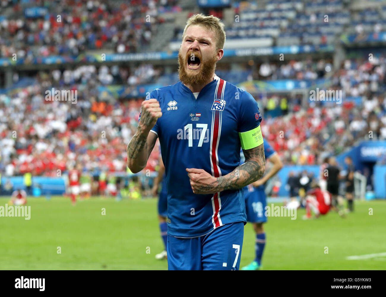 Iceland's Aron Gunnarsson celebrates after his side score a late winner during the Euro 2016, Group F match at the Stade de France, Paris. Stock Photo