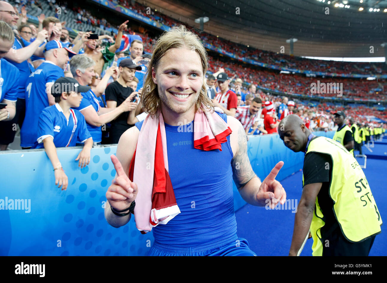 Iceland's Birkir Bjarnason celebrates qualifying for the last 16 round after the Euro 2016, Group F match at the Stade de France, Paris. PRESS ASSOCIATION Photo. Picture date: Wednesday June 22, 2016. See PA story SOCCER Iceland. Photo credit should read: Owen Humphreys/PA Wire. RESTRICTIONS: Use subject to restrictions. Editorial use only. Book and magazine sales permitted providing not solely devoted to any one team/player/match. No commercial use. Call +44 (0)1158 447447 for further information. Stock Photo