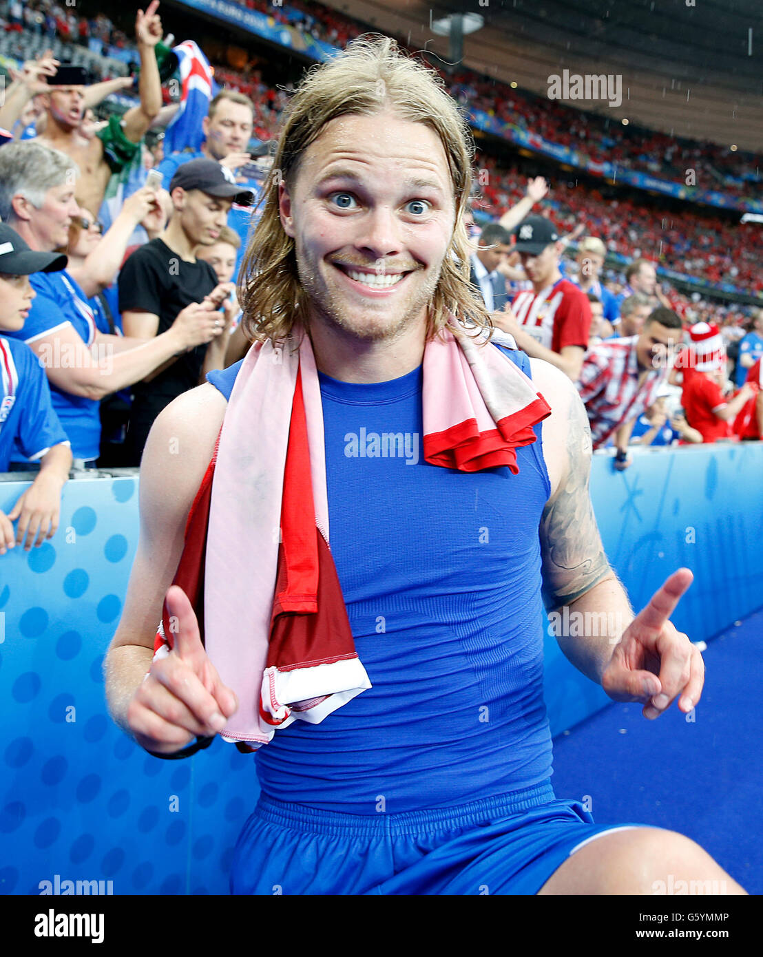 Iceland's Birkir Bjarnason celebrates qualifying for the last 16 round after the Euro 2016, Group F match at the Stade de France, Paris. Stock Photo
