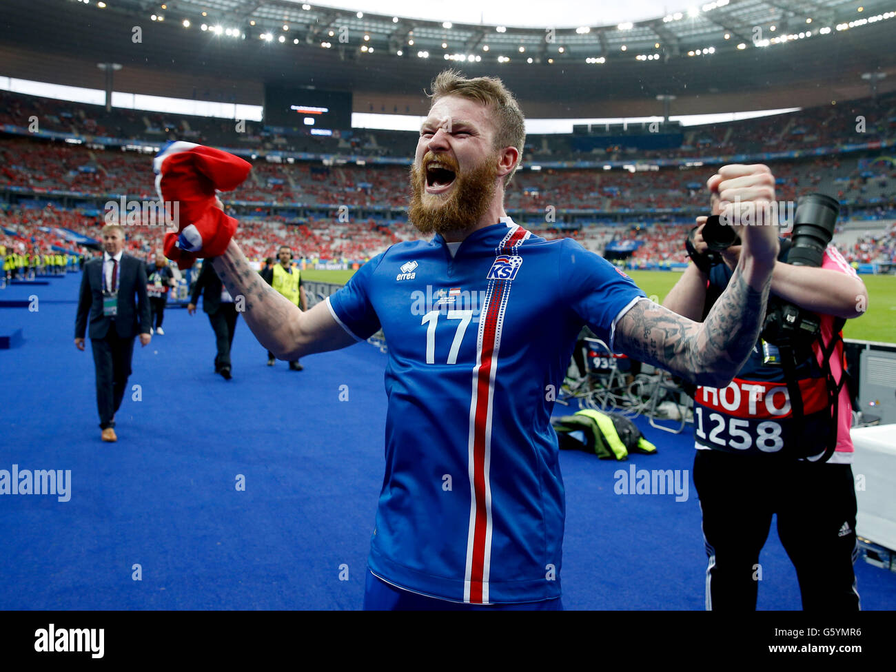 Iceland's Aron Gunnarsson celebrates qualifying for the last 16 round after the Euro 2016, Group F match at the Stade de France, Paris. Stock Photo