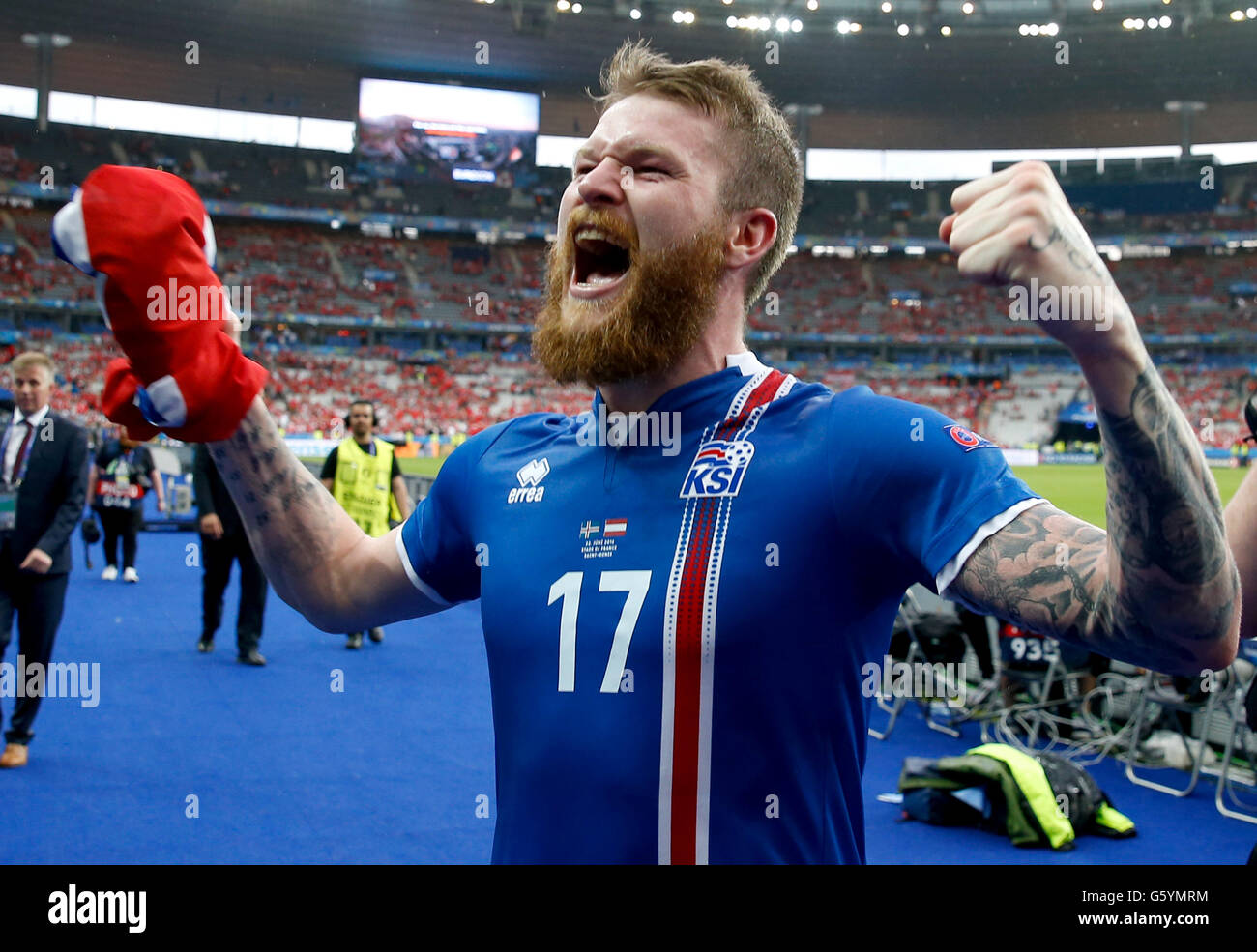 Iceland's Aron Gunnarsson celebrates qualifying for the last 16 round after the Euro 2016, Group F match at the Stade de France, Paris. Stock Photo