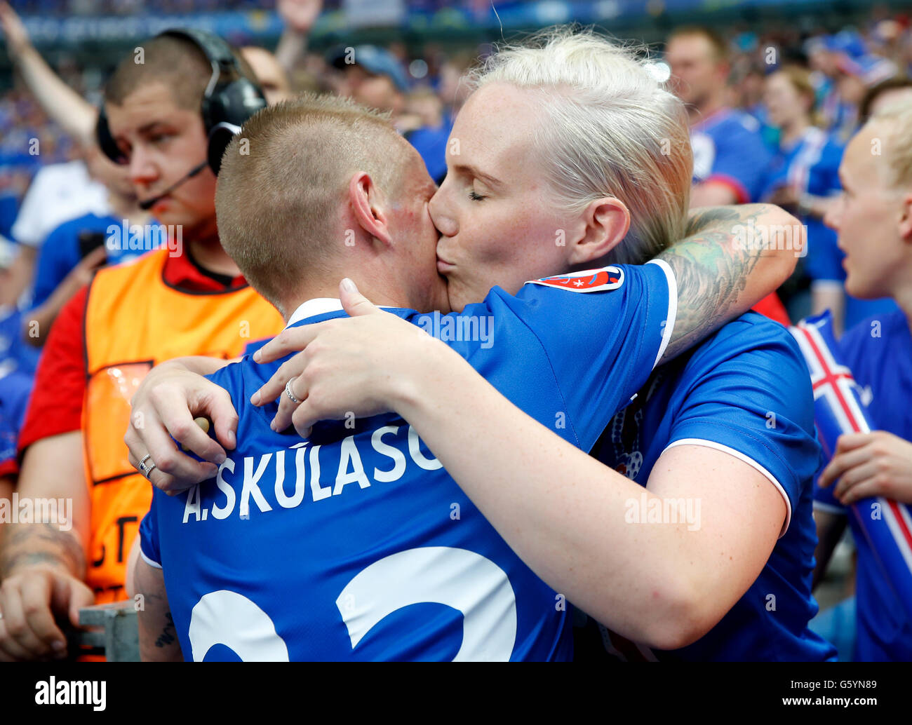 Iceland's Ari Freyr Skulason kisses his partner as he celebrates qualifying for the last 16 round after the Euro 2016, Group F match at the Stade de France, Paris. after qualifying for the last 16 round after the Euro 2016, Group F match at the Stade de France, Paris. Stock Photo