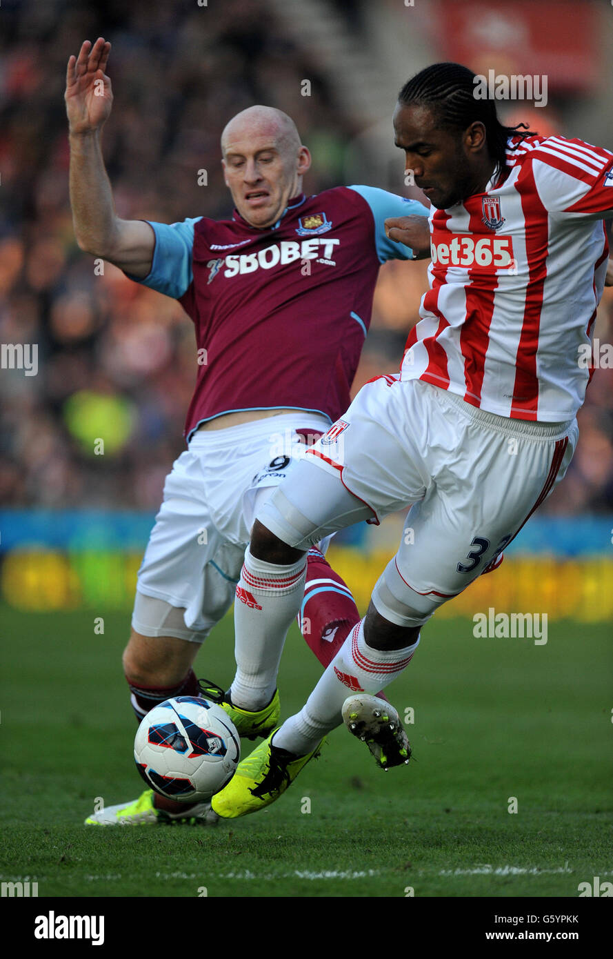 Stoke City's Cameron Jerome is fouled by West Ham United's James Collins during the Barclays Premier League match at the Britannia Stadium, Stoke. Stock Photo