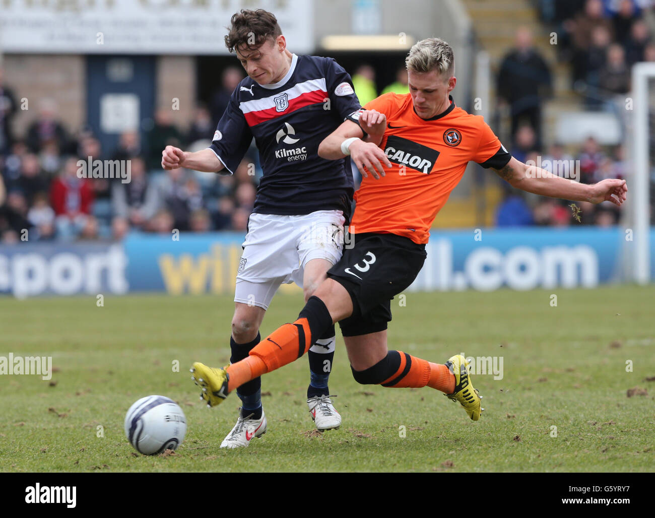 Dundee United's Barry Douglas challenges Dundee's Nicholas Riley (left ...