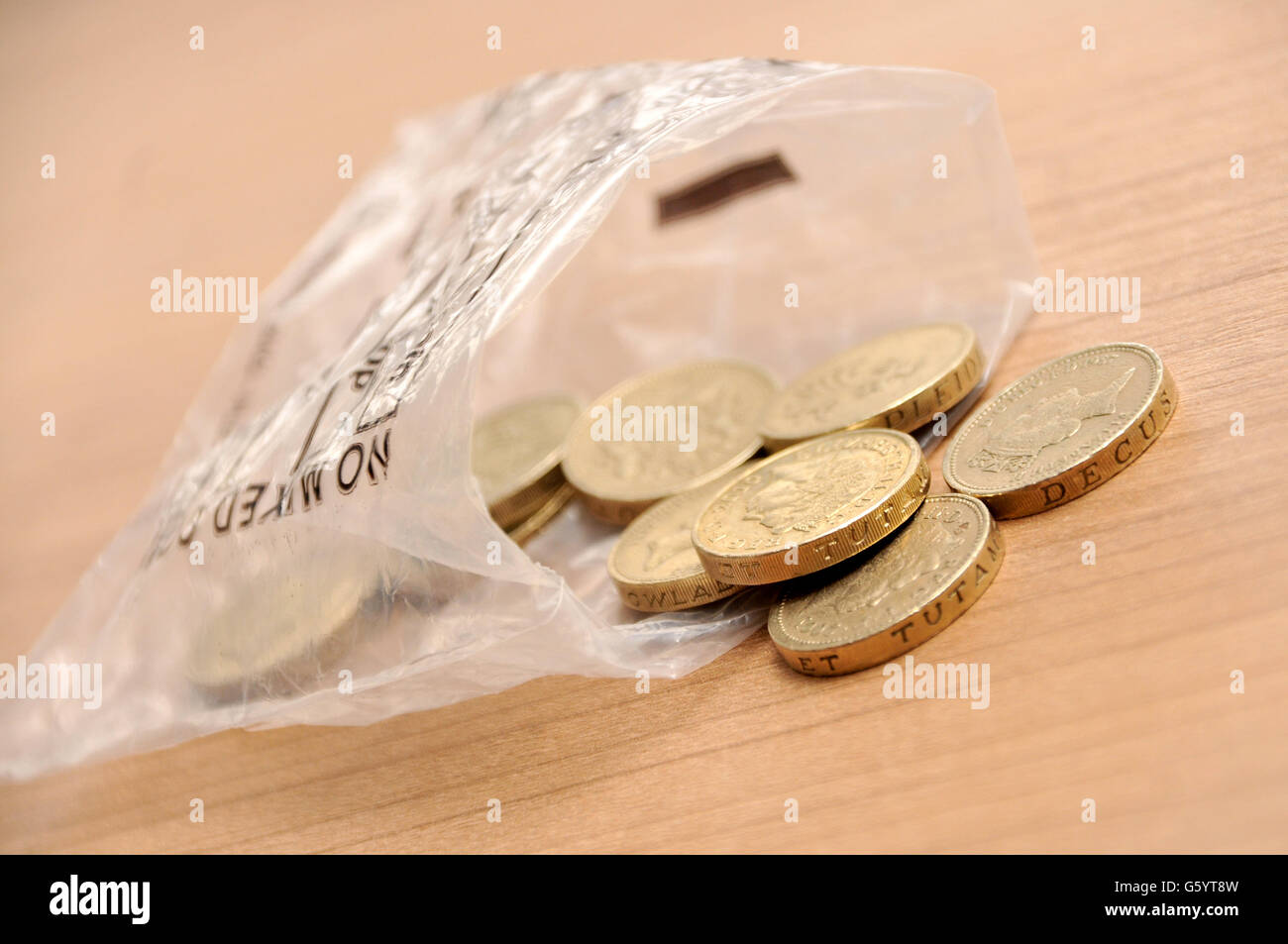 English pound coins falling out of a money bag hires stock photography and images Alamy