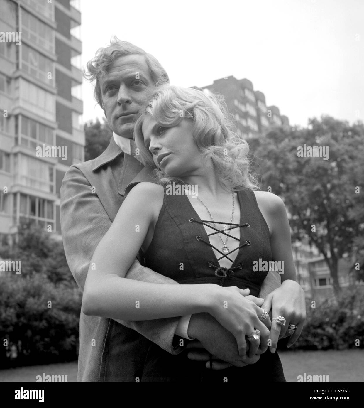 Michael Caine, playing a gangster, with Britt Ekland at Paddington, London, where they started work today on 'Get Carter', a new film directed by Mike Hodges. After two days on location in a luxury flat in Paddington, filming will continue at Newcastle-On-Tyne, where most of the the film will be shot. Stock Photo