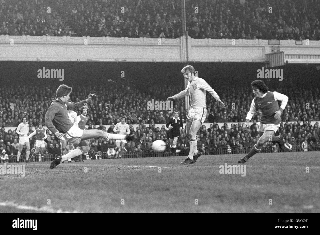 Leeds United keeper John Lukic boots away an Arsenal attack during a League One encounter at Highbury. Arsenal's Frank Stapleton is on the right, with Brian Greenhoff of Leeds in the middle. Stock Photo