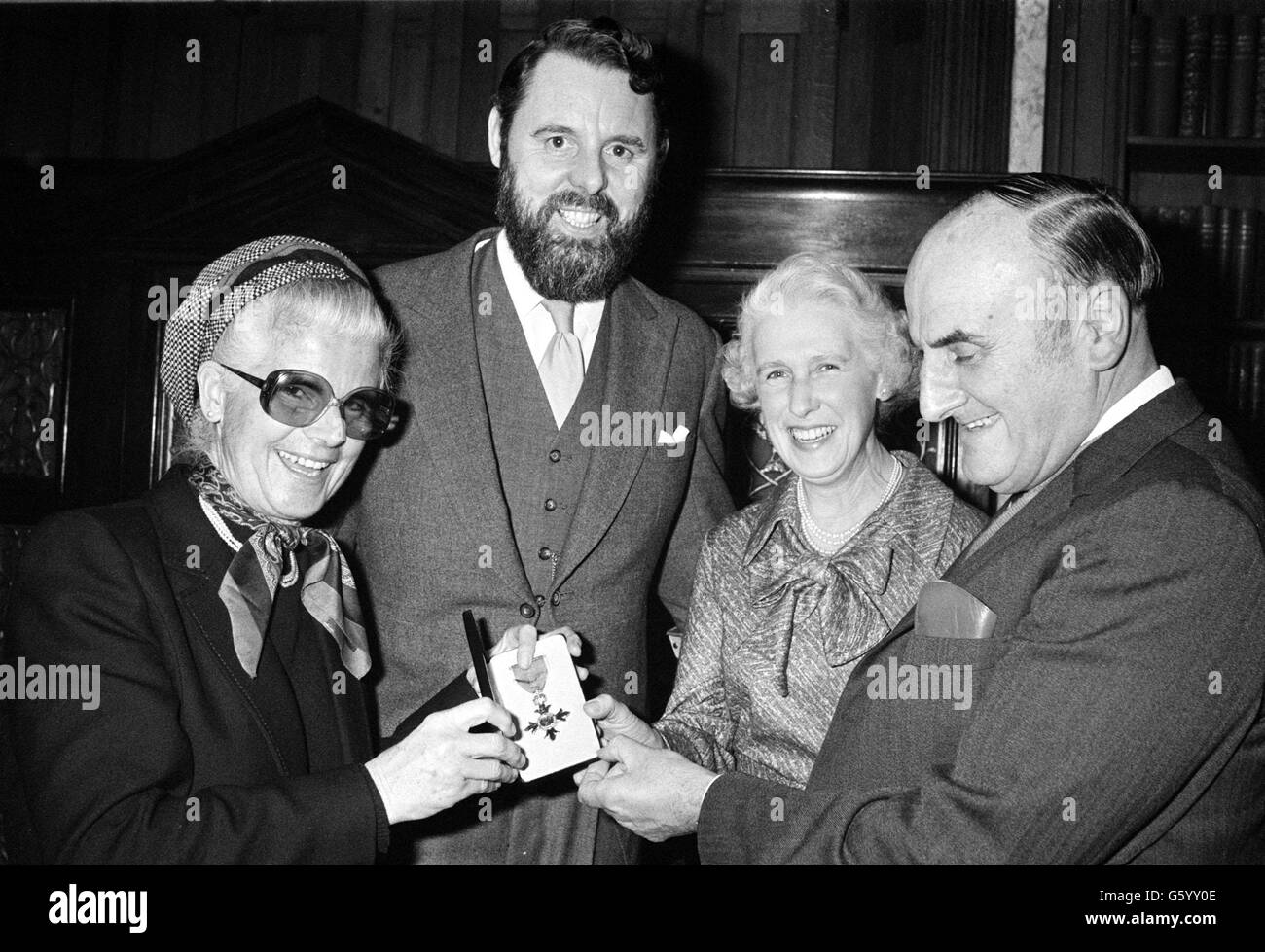 Terry Waite shows his MBE, received from the Queen at Buckingham Palace