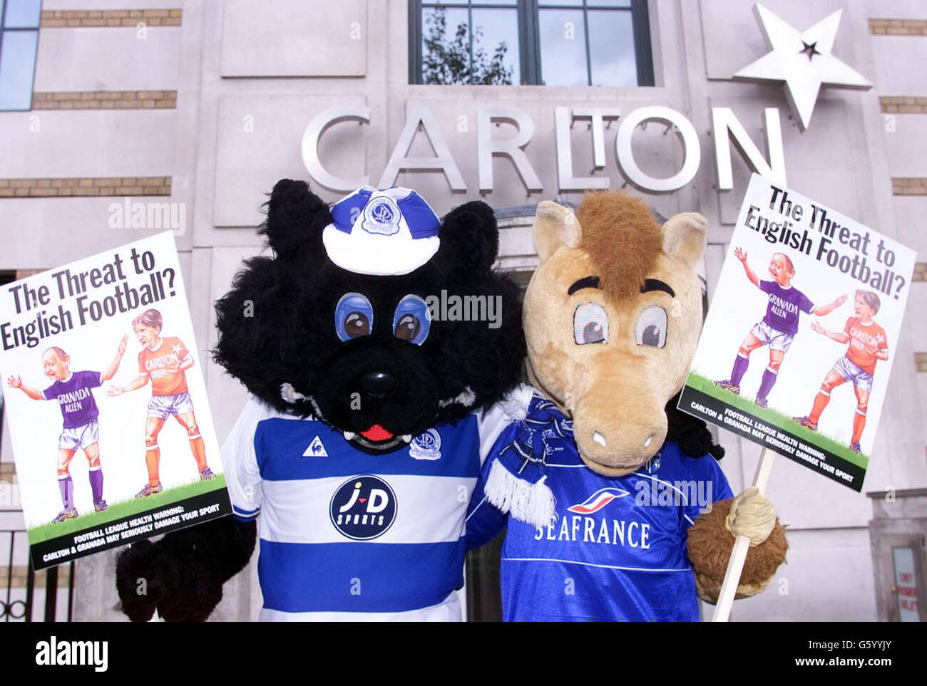 Queens Park Rangers mascot Jude the Cat (r) and Gillingham FC's mascot Tommy T outside Carlton TV headquarters in Knightsbridge, London. The mascots are protesting over the 178.5 million that was lost with the collapse of ITV Digital. Stock Photo