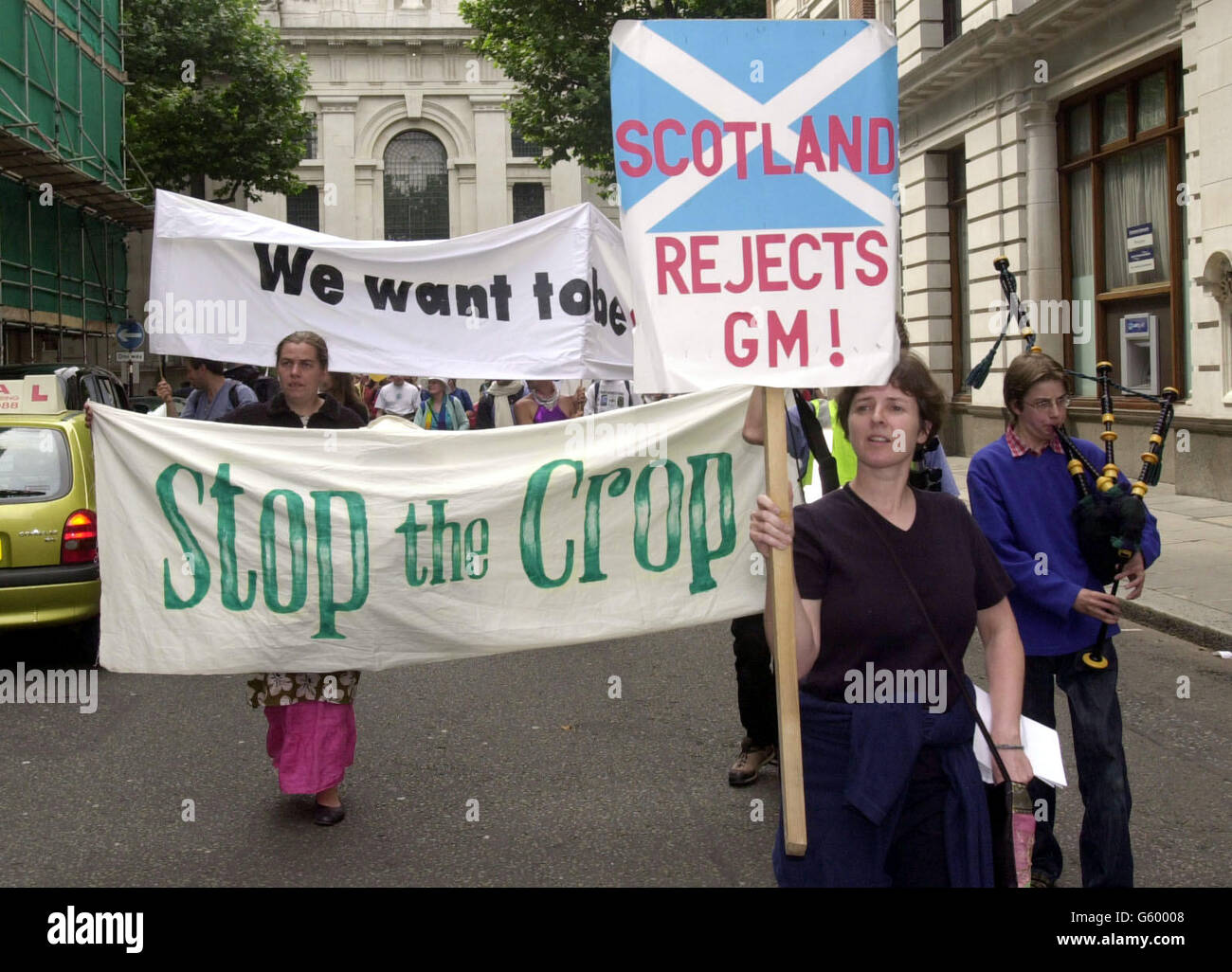 Demonstrators protesting over the use of genetically-modified crops march to the Department for Environment, Food and Rural Affairs (Defra) in Smith Square, London. * About 250 people protesting over the use of GM food brought crops to the office after tearing them from 17 trial sites across Britain. Stock Photo