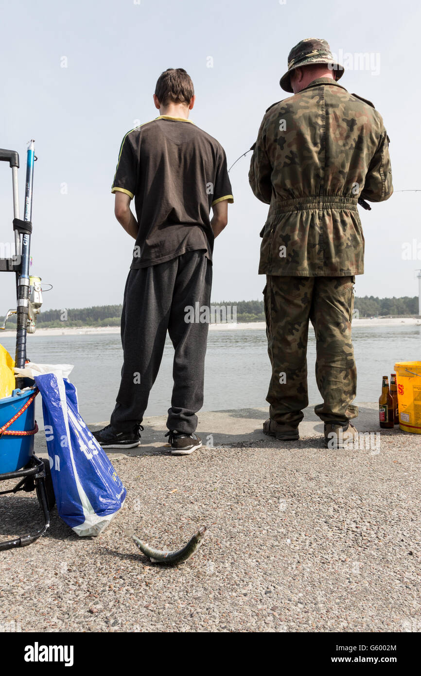 Man fishing herring in Baltic Sea. Stock Photo