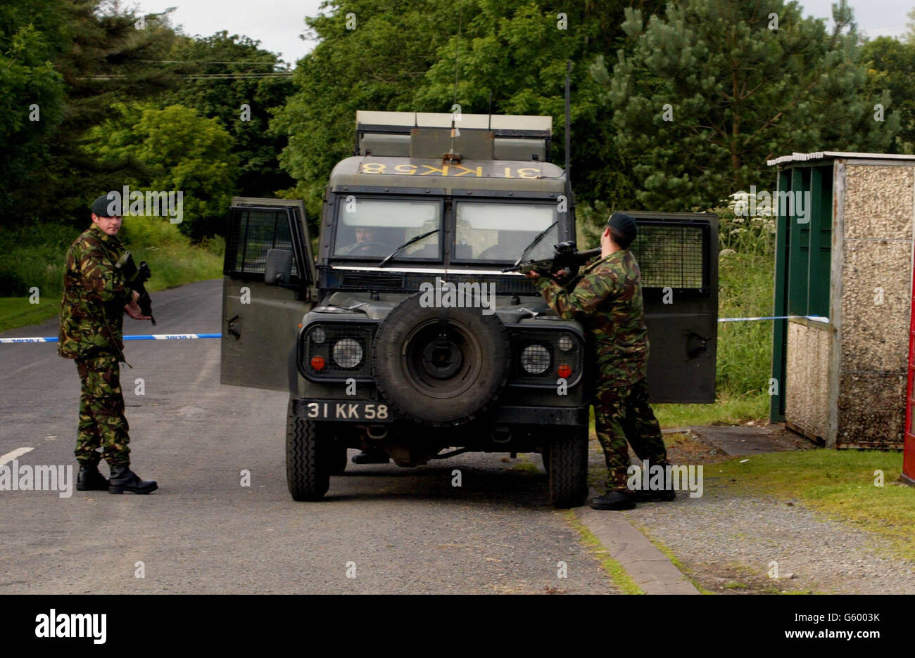 British soldiers from the Royal Irish Regiment secure the area around Brookeborough, County Fermanagh, Northern Ireland. Dissident republicans tonight claimed responsibility for an explosion close to the Co Fermanagh estate of Unionist peer Lord Brookeborough. *...The Continuity IRA said it had set off a bomb at Colebrooke, and police said they had sealed off the area following reports of a loud explosion during the night. Stock Photo