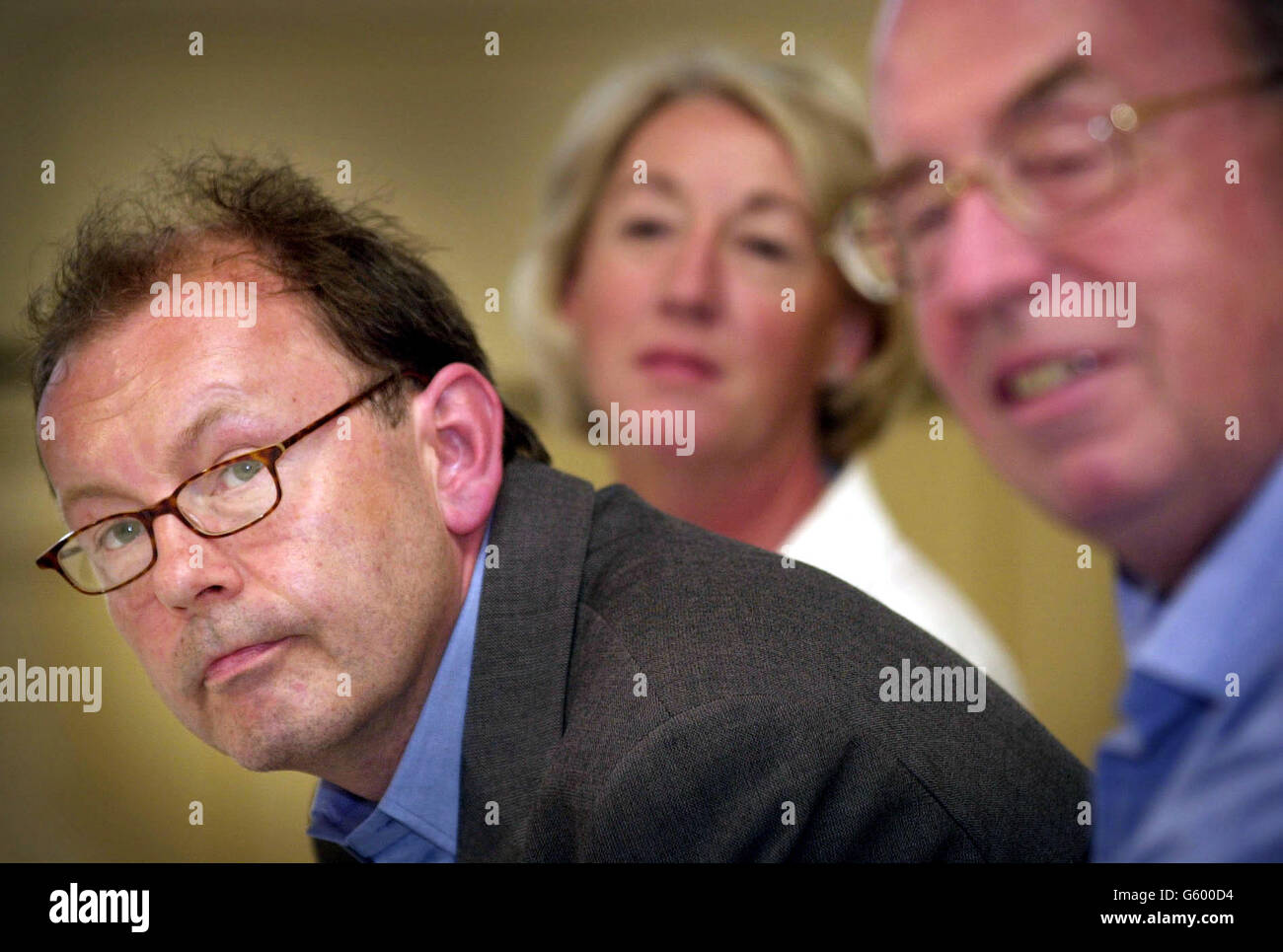 Michael Boyd (left), who was named as the new artistic director of the Royal Shakespeare Company, talks at a news conference in London alongside Deputy Chairman Susie Sainsbury (centre) and Chairman Lord Bob Alexander (right). *Boyd, an associate director of the company, succeeds Adrian Noble who quit earlier this year following criticism of his revamp plans. The new boss, who is 47, is widely respected in the theatre world and won the Olivier Award for best director for Noble ran into difficulties after criticism of his plans which included demolishing and rebuilding the RSC's Stratford upon Stock Photo