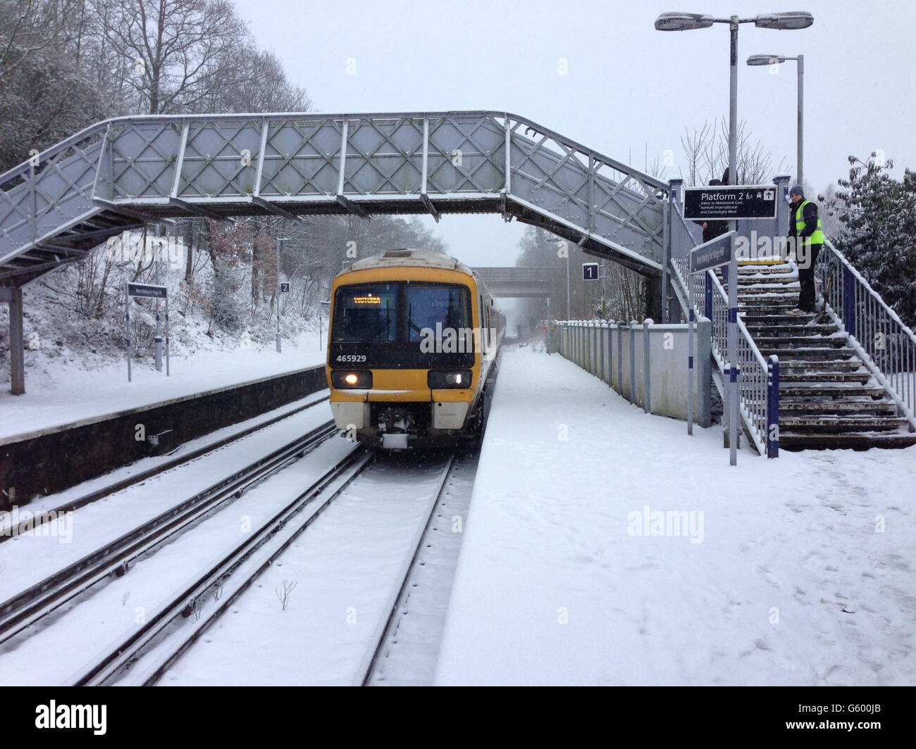 A Southeastern train arrives in the snow at West Malling station in Kent.  Parts of Kent continue to experience transport difficulties following  snowfall Stock Photo - Alamy