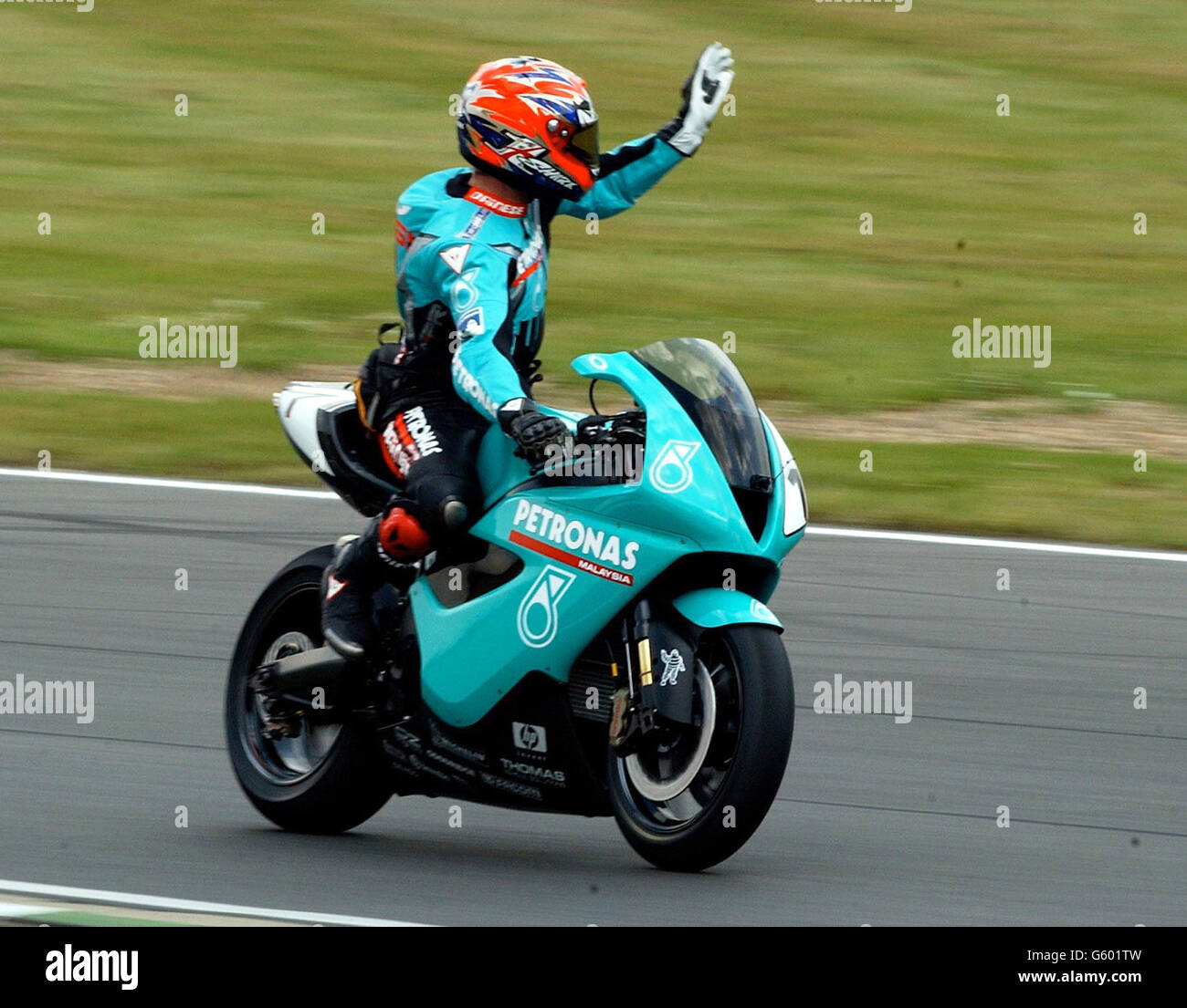 World Super bikes Championship at Brands Hatch, Kent UK. Fromer World Champion and now team manager Carl Fogerty does a lap for the fans to show off his 3 cylinder Foggy-Petronas race bike Stock Photo