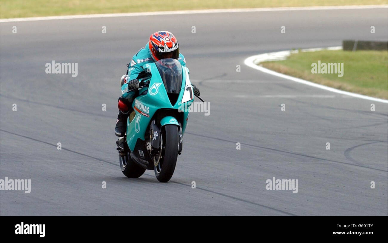 World Super bikes Championship at Brands Hatch, Kent UK. Fromer World Champion and now team manager Carl Fogerty does a lap for the fans to show off his 3 cylinder Foggy-Petronas race bike Stock Photo