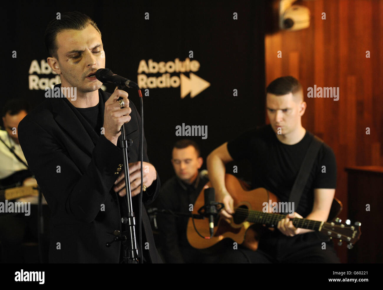 Theo Hutchcraft (left) and Adam Anderson (right) of Hurts perform during a live music session for Absolute Radio at their studios in London. Stock Photo