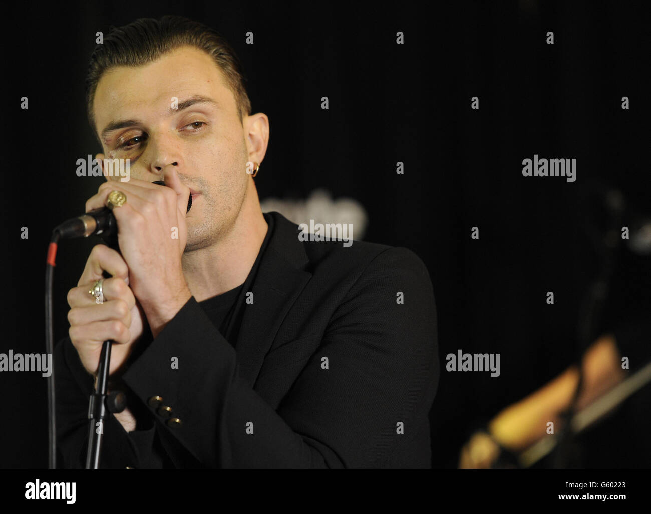 Theo Hutchcraft of Hurts performs during a live music session for Absolute Radio at their studios in London. Stock Photo