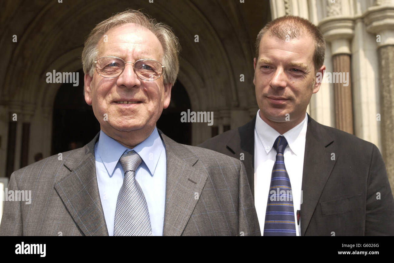 Maurice Balchin (left) and Warren Balchin stand triumphantly outside The High Cour after the Royal Court of Appeal overturned his local council's decision to build a by-pass on his property. Mr Balchin had recently undertaken extensive renovation on his property in Norfolk, when the council announced their plans. Stock Photo