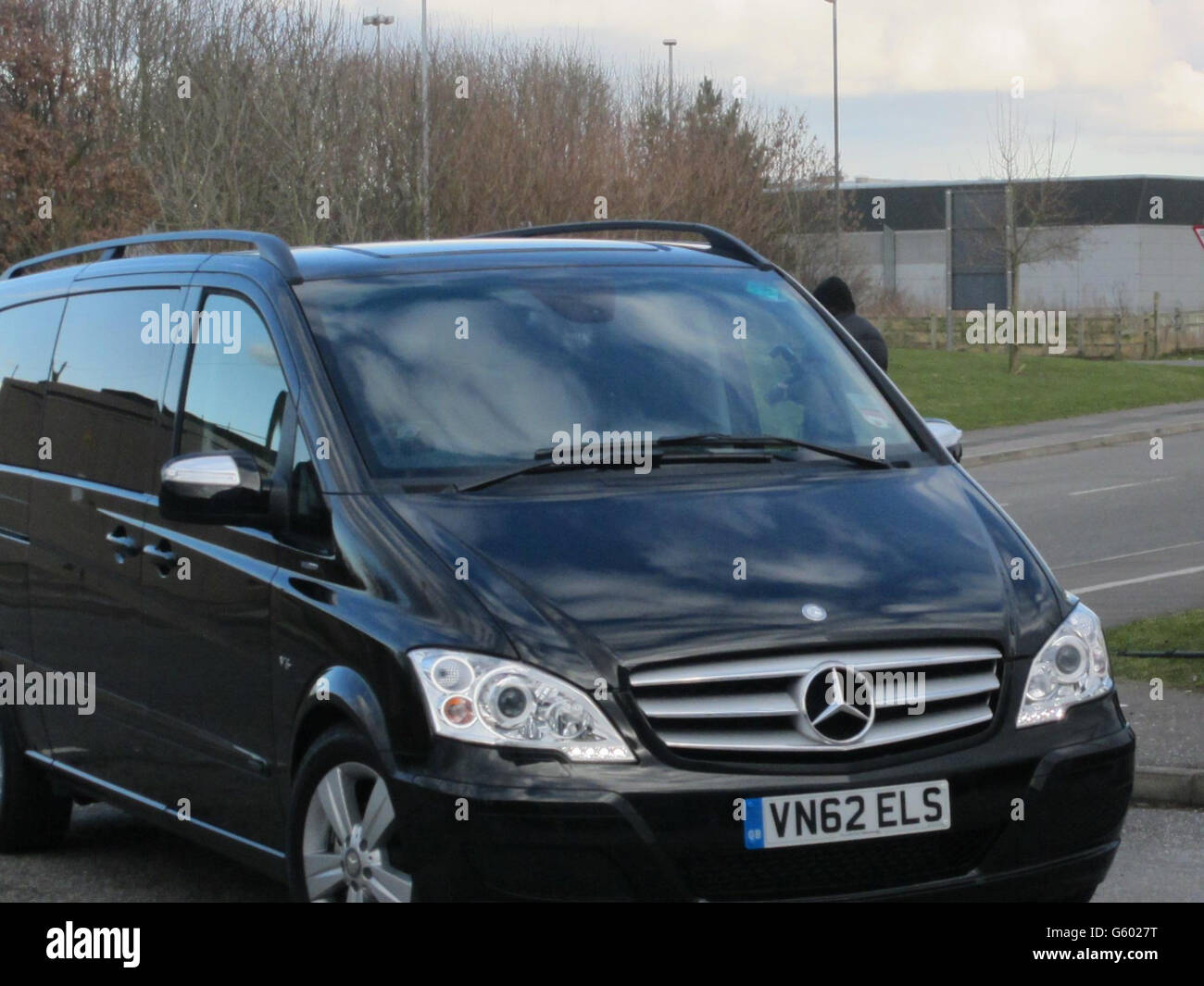 The vehicle carrying Manchester City footballer Carlos Tevez arrives at Cheshire Constabulary Custody Suite in Middlewich as he has been charged with driving while disqualified and driving without insurance, Cheshire Police said. Stock Photo