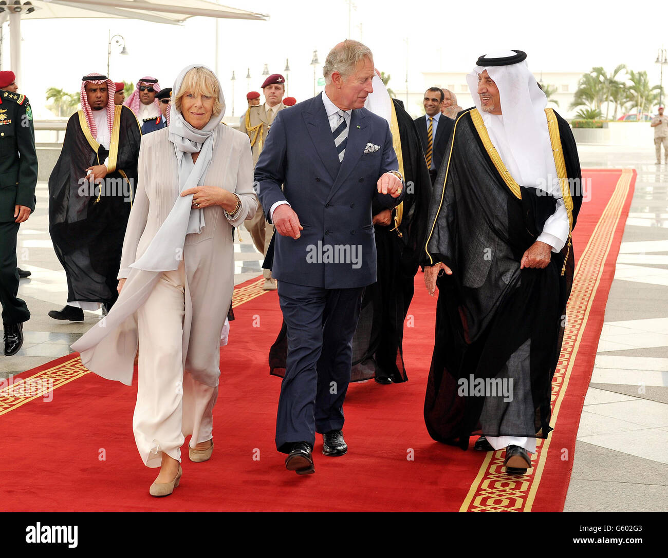 The Prince of Wales and Duchess of Cornwall are meet at Jeddah Airport by the Governor of Makkah Prince Khalid al Faisal (right), after arriving by plane from Riyadh to the Red Sea coastal city in Saudi Arabia. Stock Photo