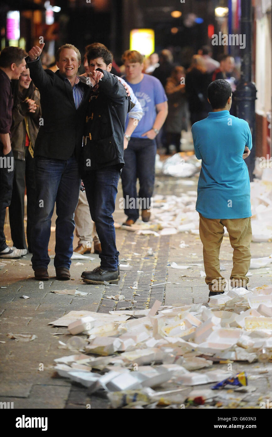 Revellers enjoy a Saturday night out on Caroline Street, commonly known as Chip Alley in Cardiff