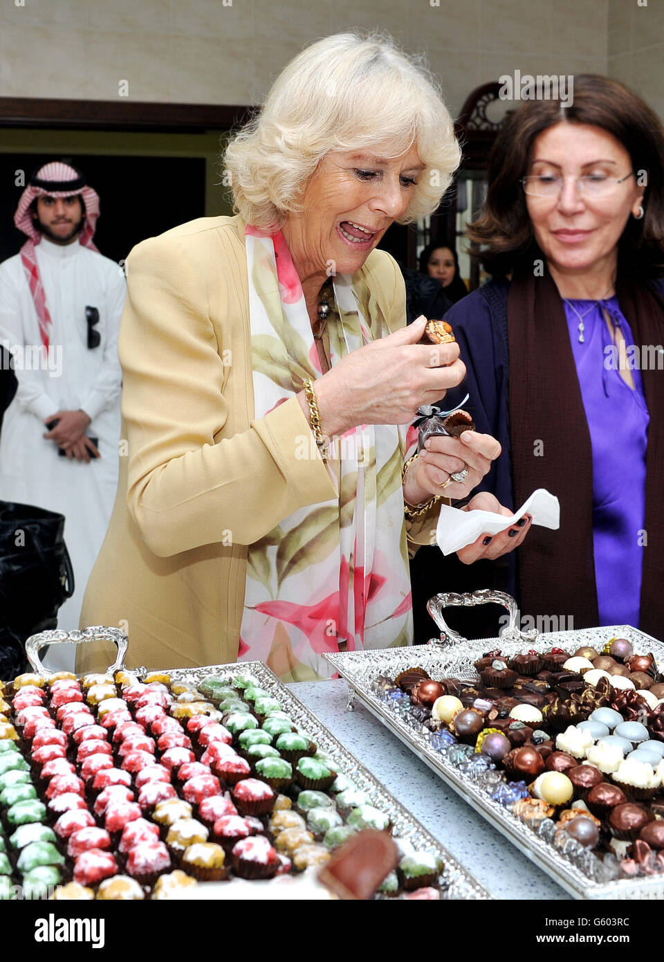 The Duchess of Cornwall tries some chocolates made by women who are learning cooking skills at the Bab Rizq Jameel Nafisa Shams Female Academy for Arts and Crafts, in the city of Jeddah in western Saudi Arabia. Stock Photo