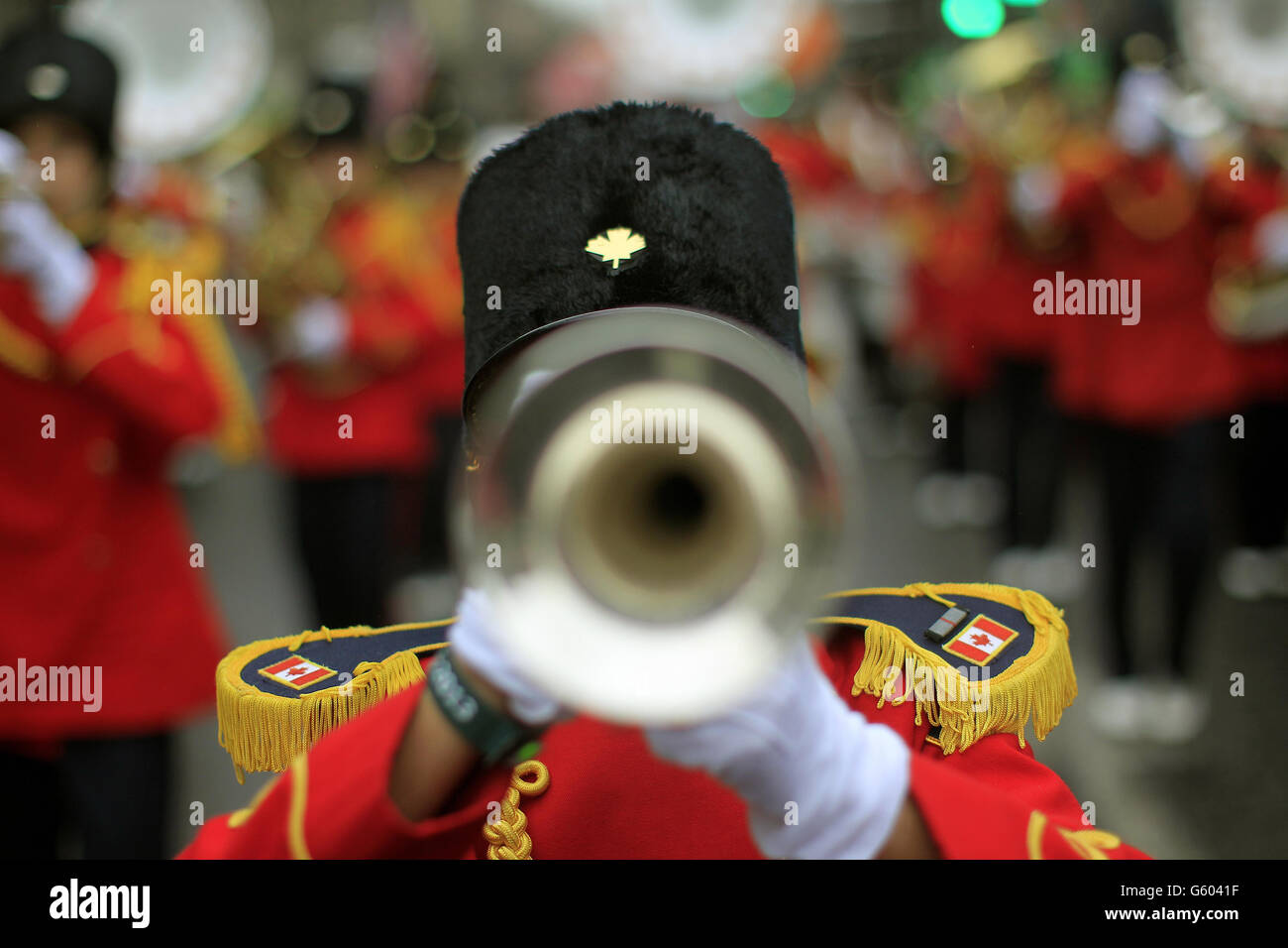 A Canadian marching band joins revellers during the St Patrick's day parade through Dublin city centre on St Patrick's day. Stock Photo