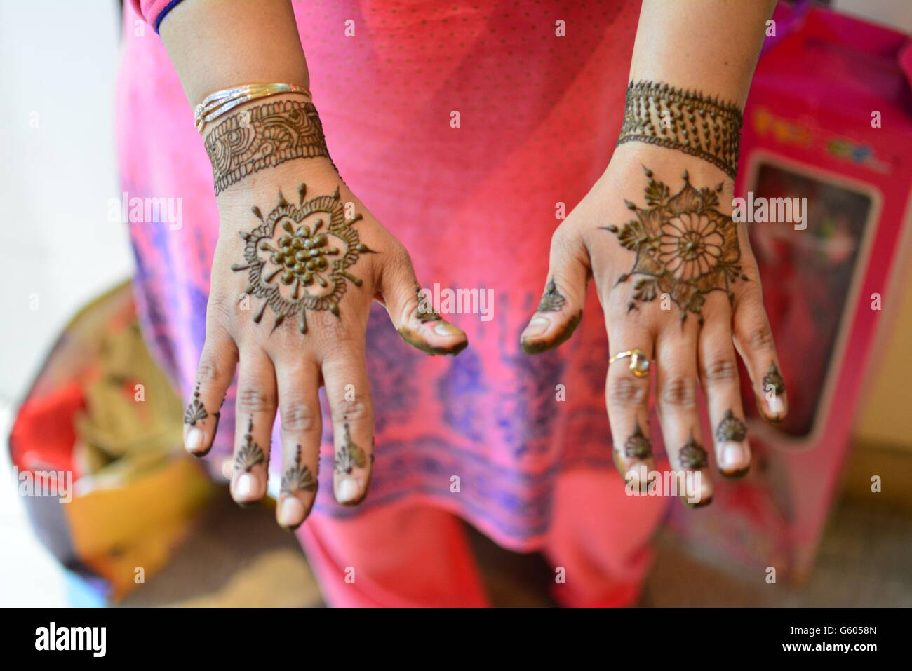 henna design on the back of a married indian girl Stock Photo