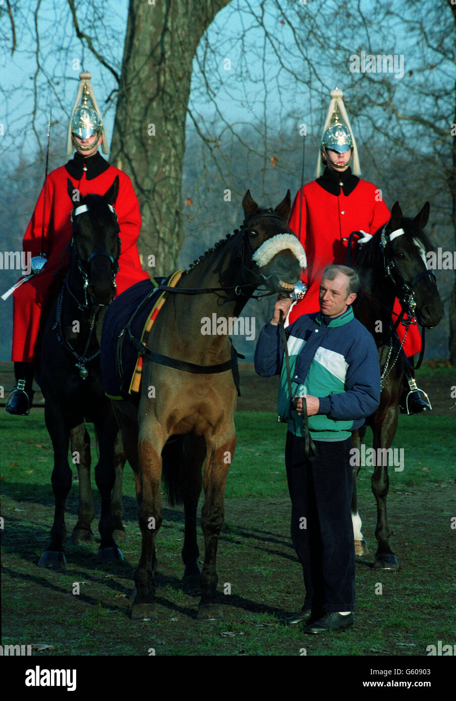 Triple Grand National winner Red Rum with groom Ken Critchley on a visit to the Household Cavalry at their Hyde Park barracks. * 03/04/03 One of the horseshoes of Red Rum from when he won his third and record-breaking Grand National in 1977 will go on sale, it was announced, during Sotheby's Sporting Sale in November. Stock Photo