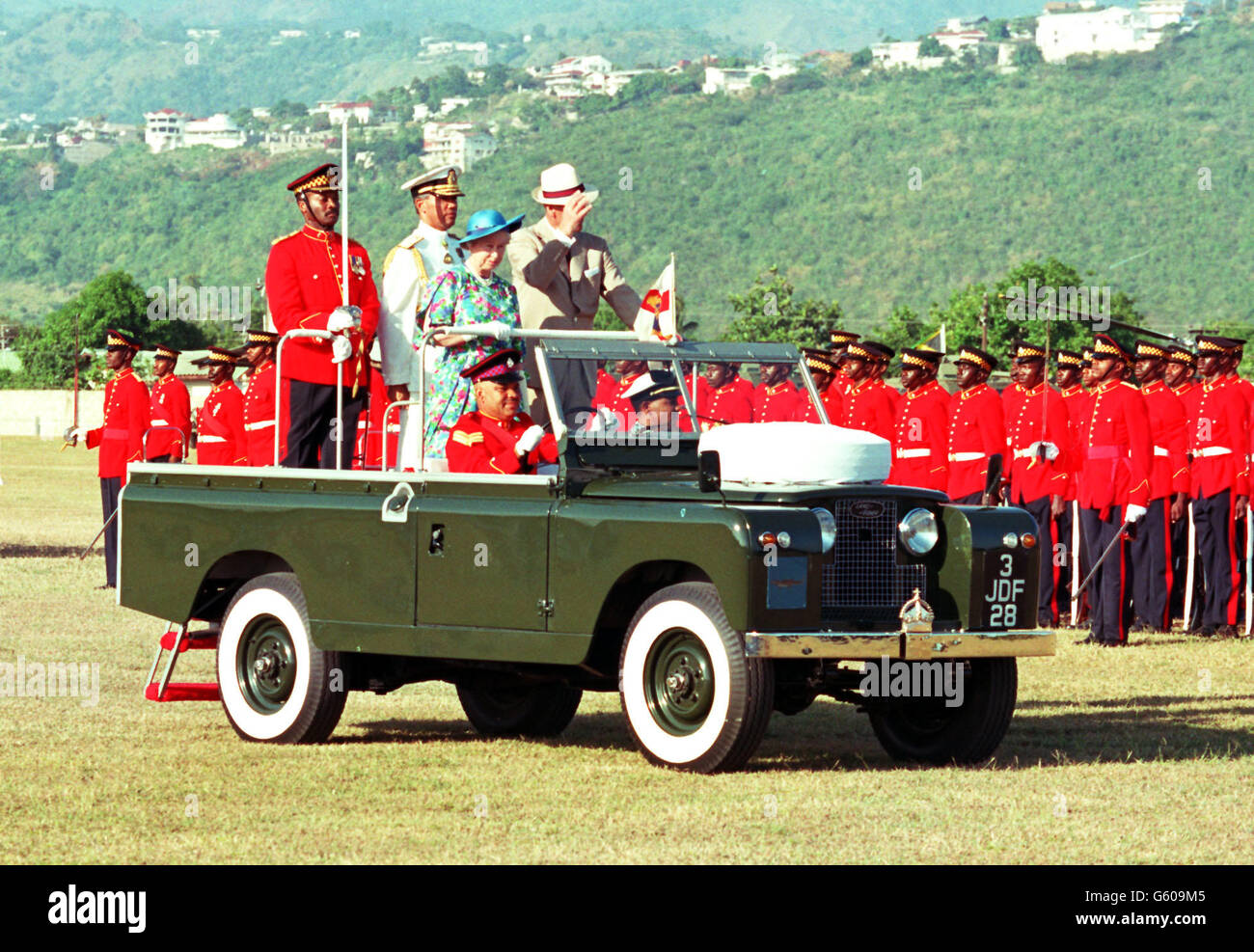 The Queen and the Duke of Edinburgh ride in an open-topped Landrover as they inspect members of the Second Battalion of the Jamaica Regiment, during the Trooping of The Colour in Kingston, Jamaica. Stock Photo
