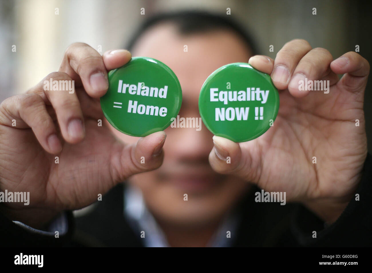 A member of the Justice For The Undocumented Campaign (who wishes to hide his identity) poses for pictures at a press conference on immigration reform in the US and regularisation of undocumented migrants in the US and Ireland, at Buswells Hotel in Dublin today. Stock Photo