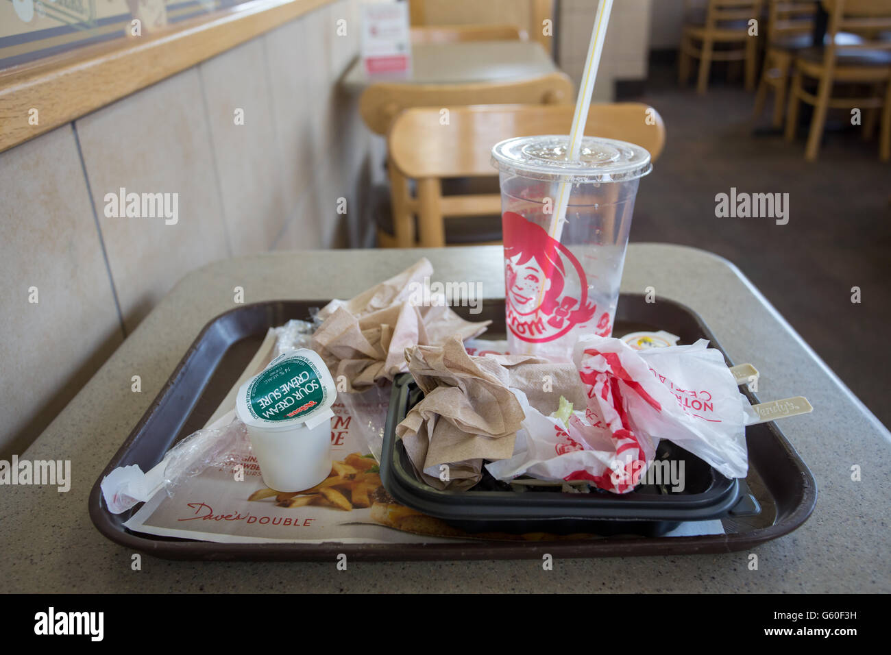junk food trash inside fast food restaurant Stock Photo