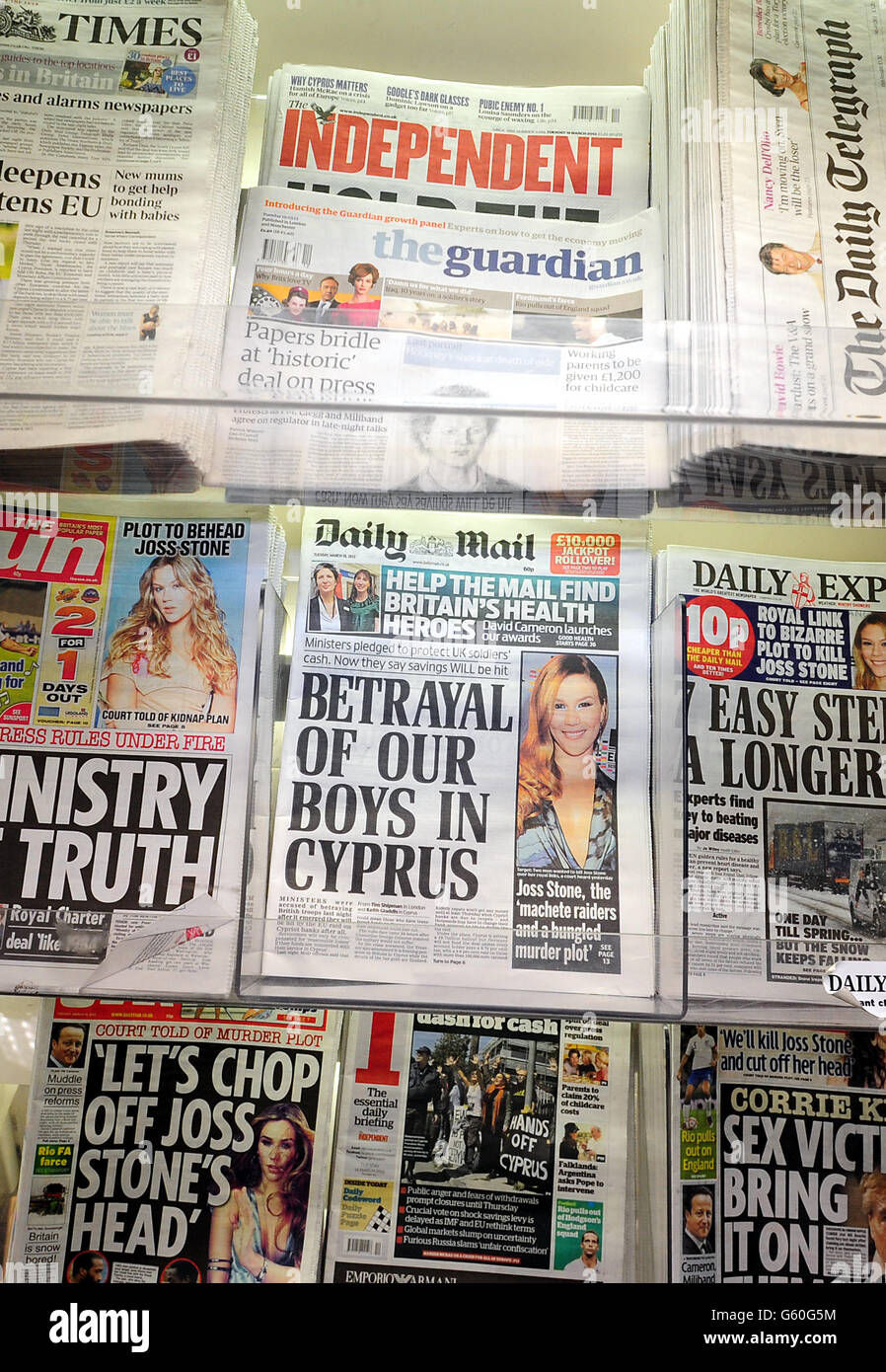 General view of newspapers on sale the morning after the three political parties agreed on a Royal Charter that would safeguard investigative journalism and freedom while protecting the victims of press intrusion, in line with the recommendations of Lord Justice Leveson that was met however with outrage and scepticism across much of Fleet Street today . Stock Photo