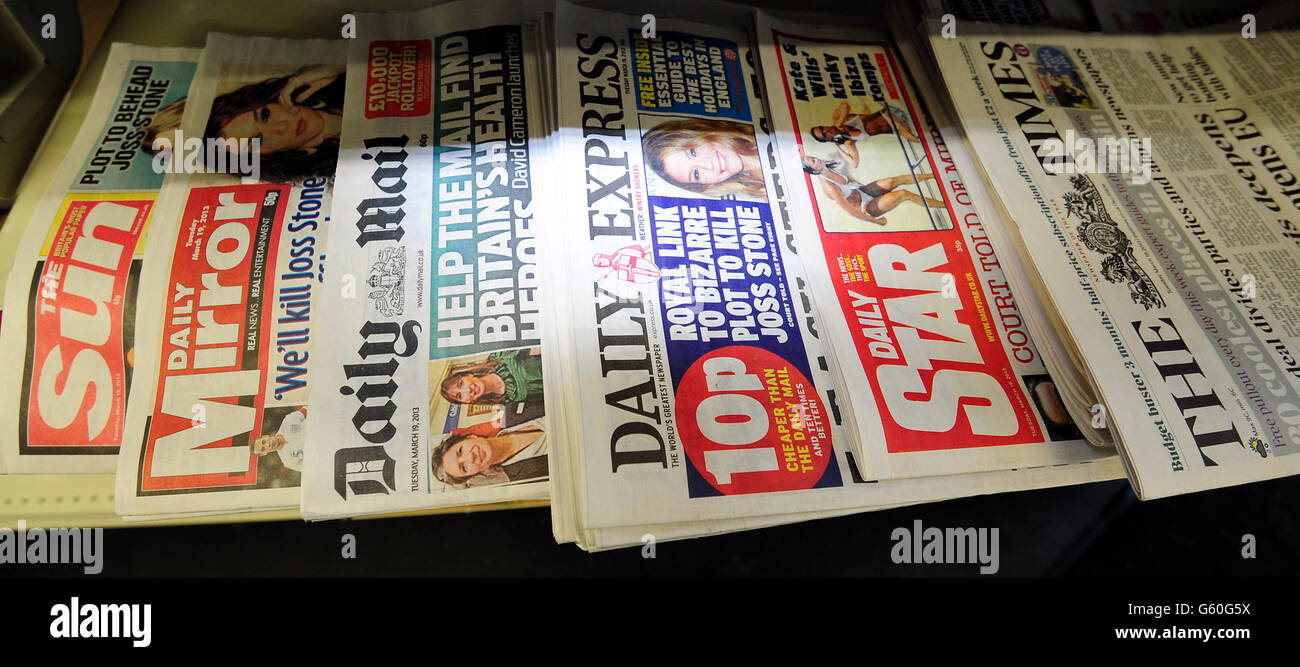 General view of newspapers on sale the morning after the three political parties agreed on a Royal Charter that would safeguard investigative journalism and freedom while protecting the victims of press intrusion, in line with the recommendations of Lord Justice Leveson that was met however with outrage and scepticism across much of Fleet Street today . Stock Photo